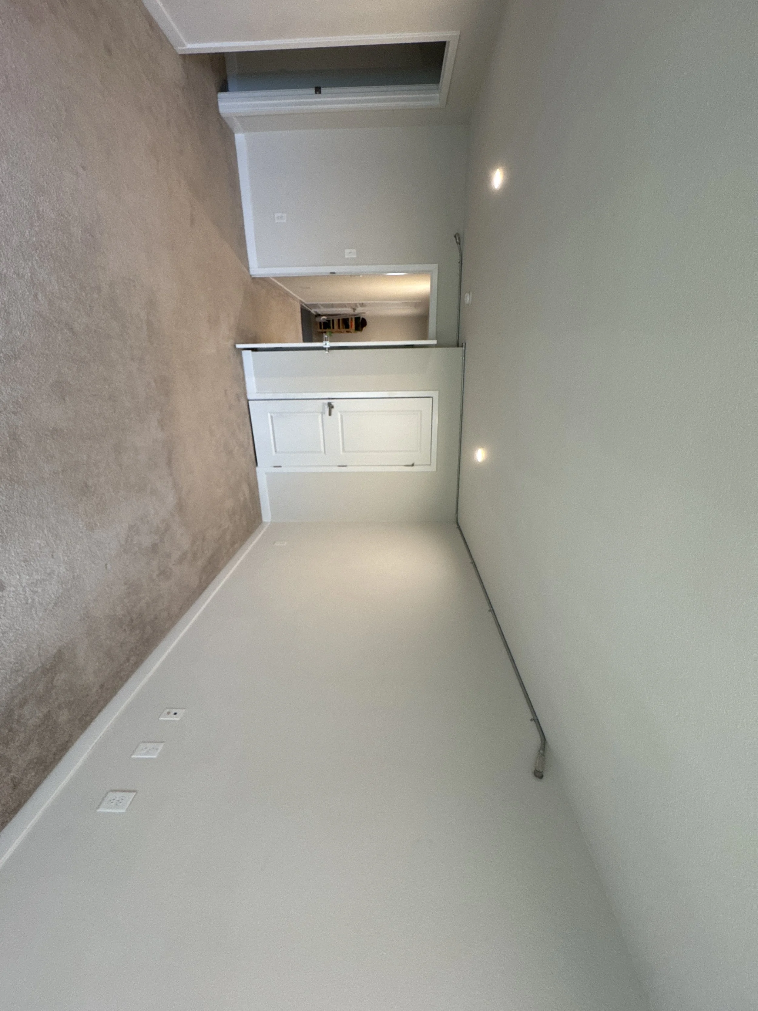 Recessed fixtures lighting a hallway ceiling