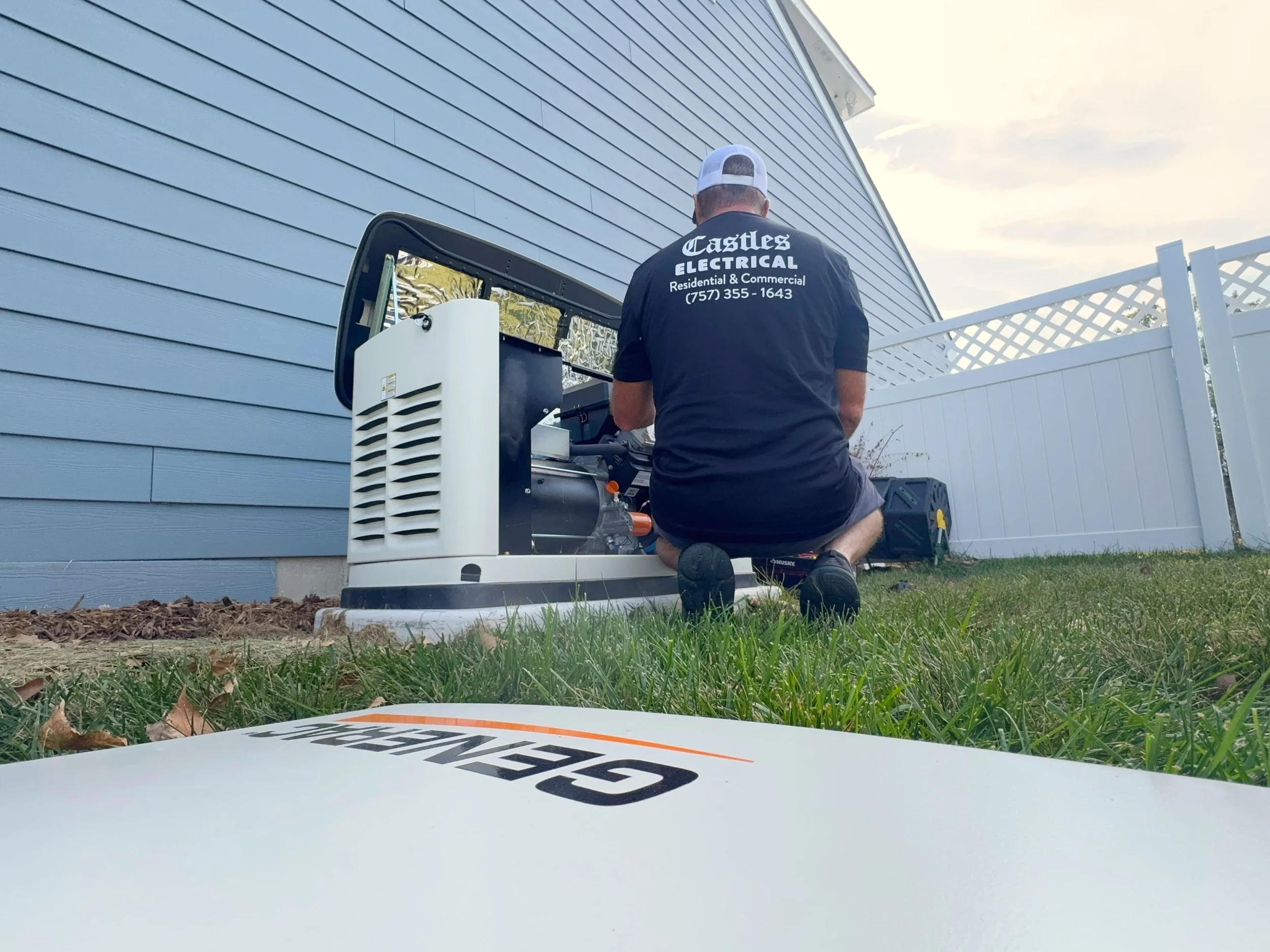 Castles Electrical electrician working at a standby generator on its pad