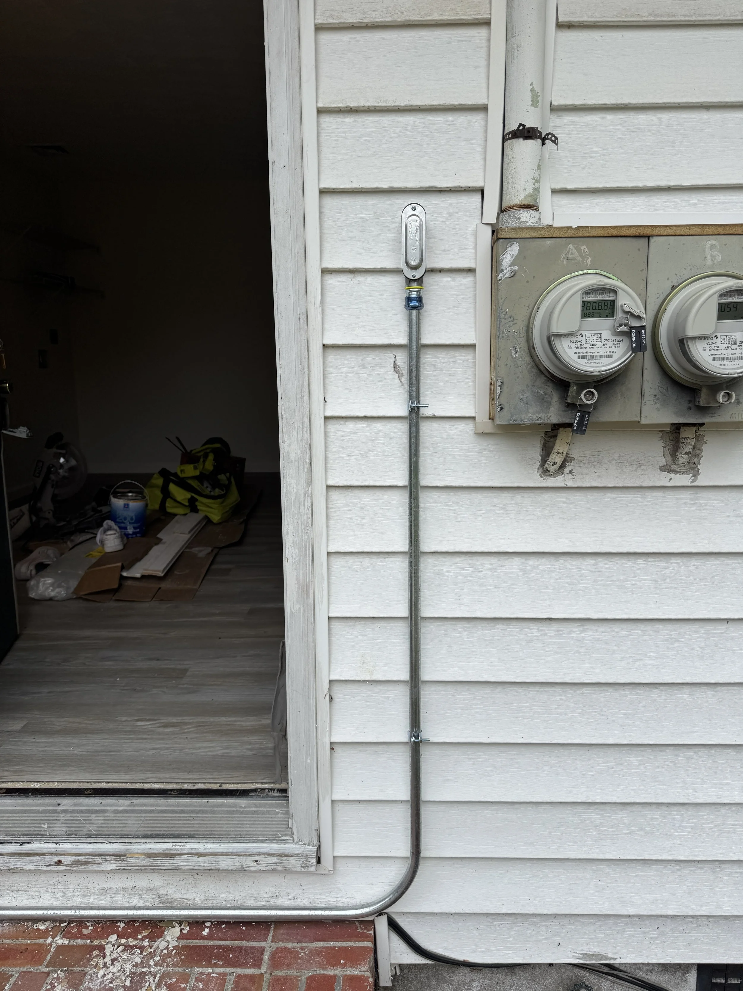 Crawlspace opening beside the meters on a Suffolk, VA home