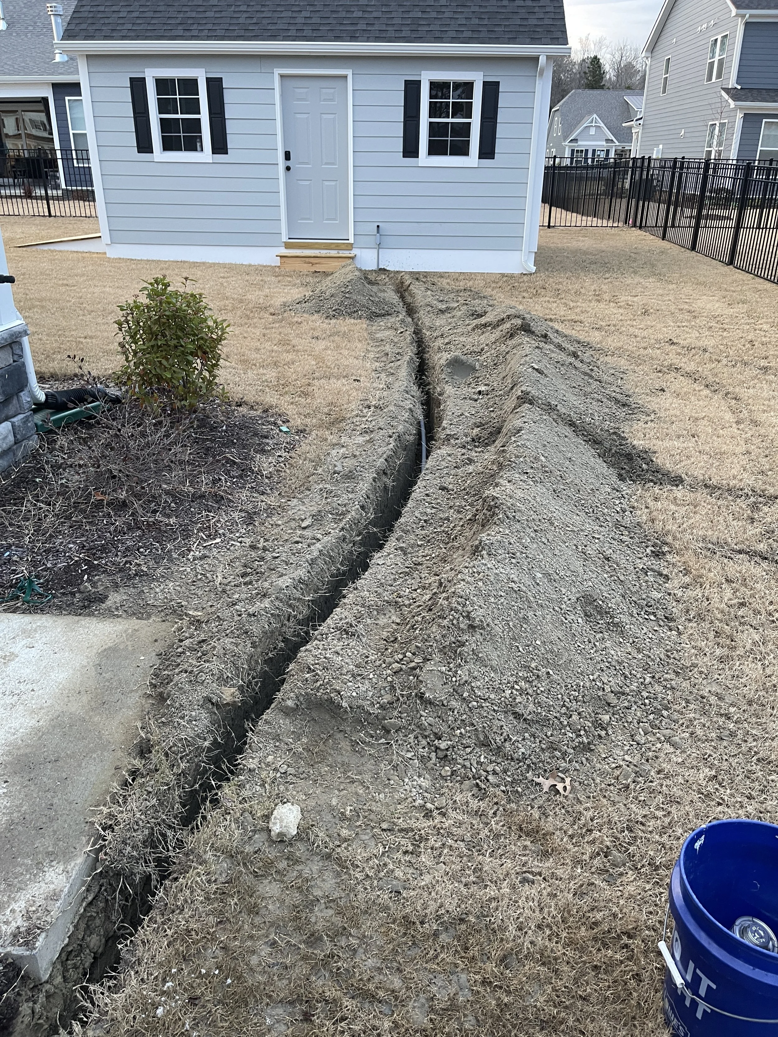 Underground run trenched from the house to a detached building on a Suffolk, VA property