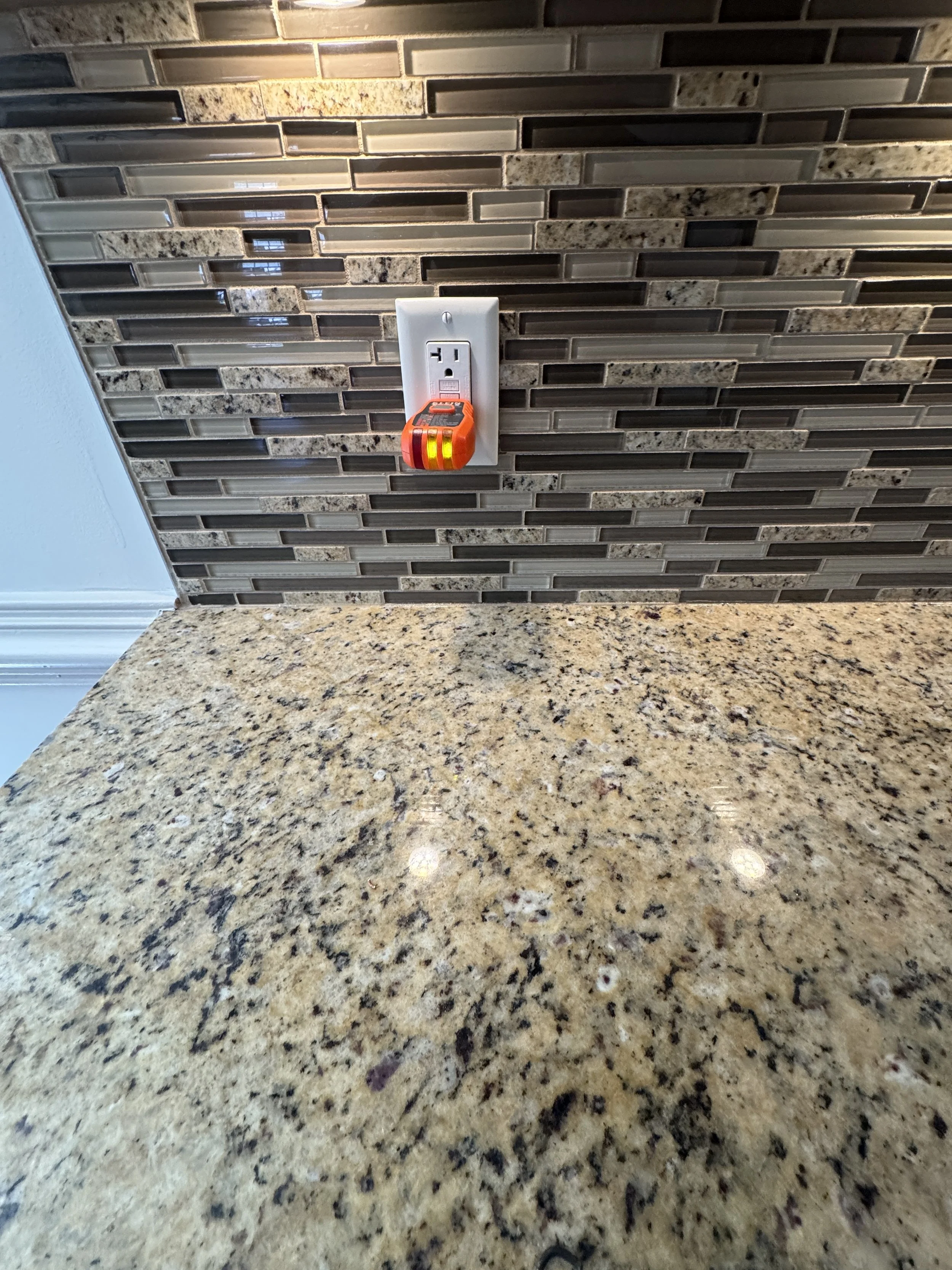 New grounded receptacle finished into a kitchen wall on a Suffolk, VA job