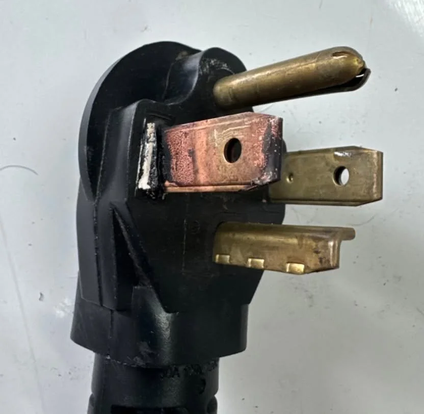 Three-prong 240-volt range plug from a Norfolk, VA kitchen