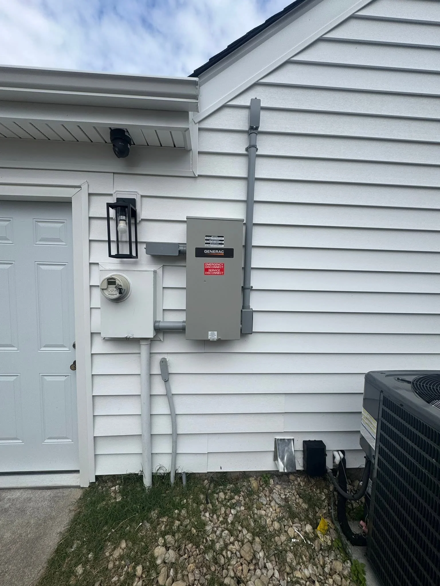 Meter and outdoor equipment on the wall of a Chesapeake, VA house