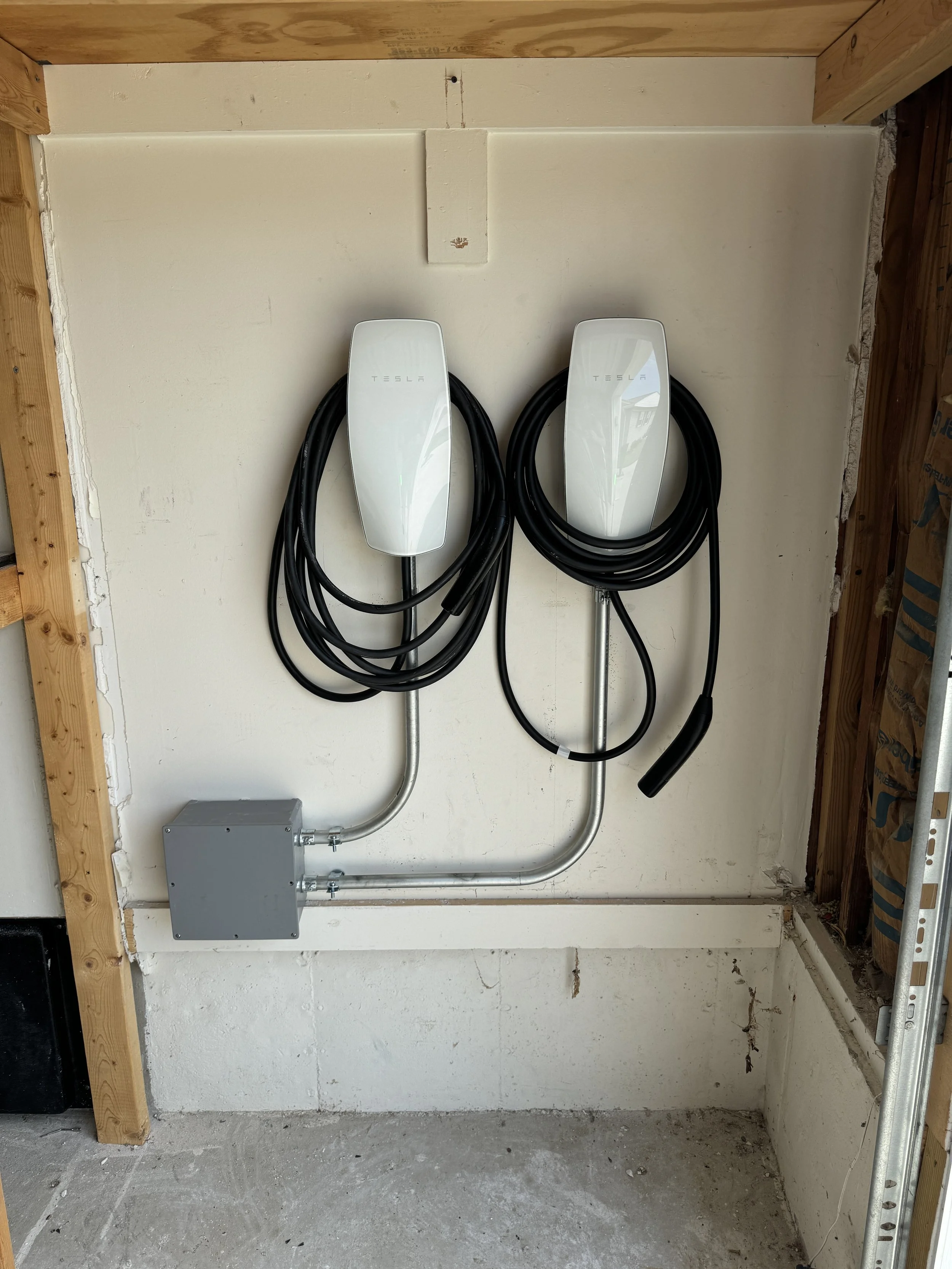 Wall connectors mounted inside a shop building on a Suffolk, VA property