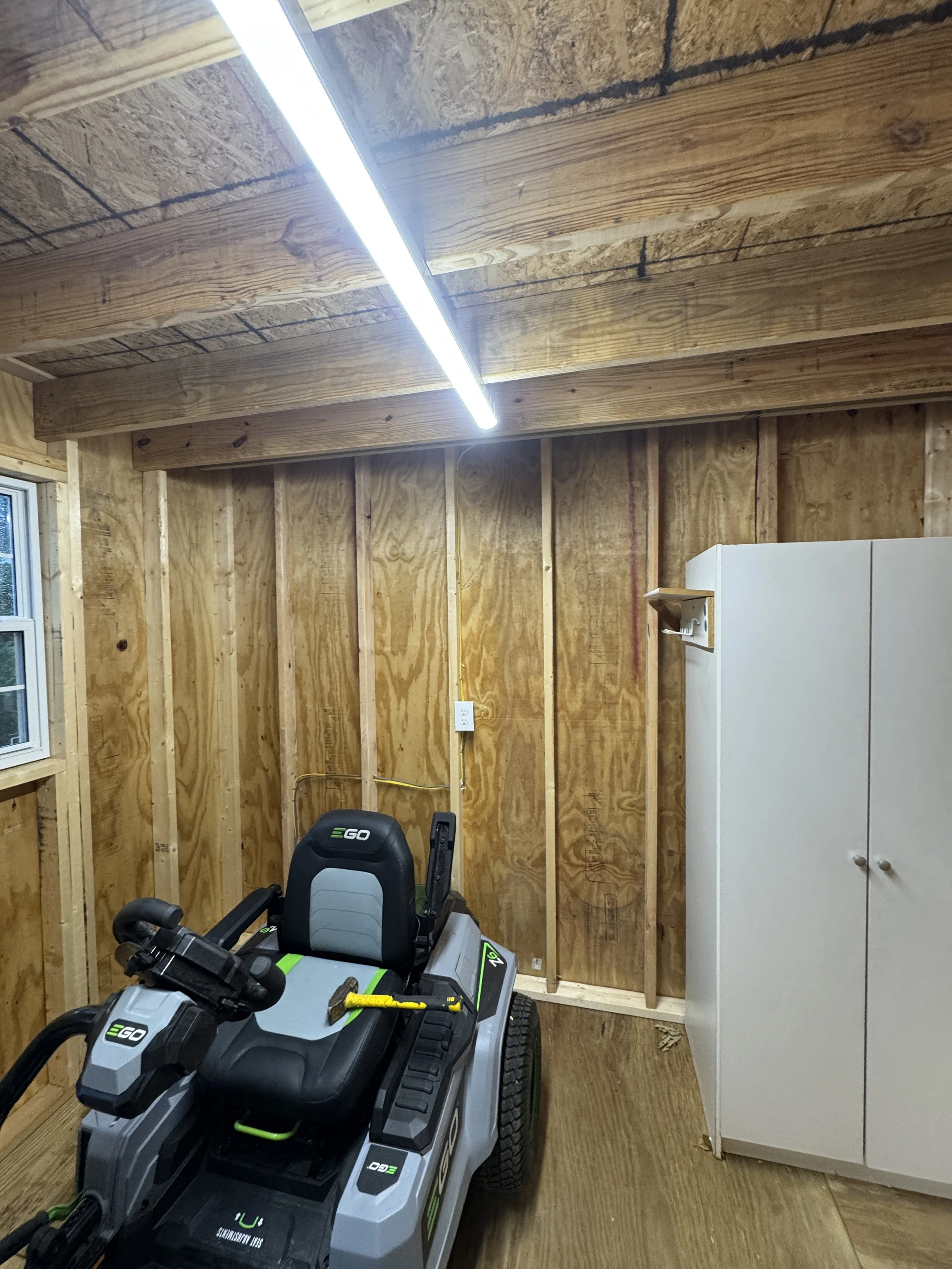 Inside a detached outbuilding wired and lit on a Suffolk, VA property