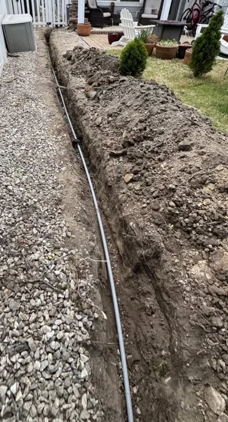 Conduit laid in a trench on the way to outdoor equipment at a Norfolk, VA home
