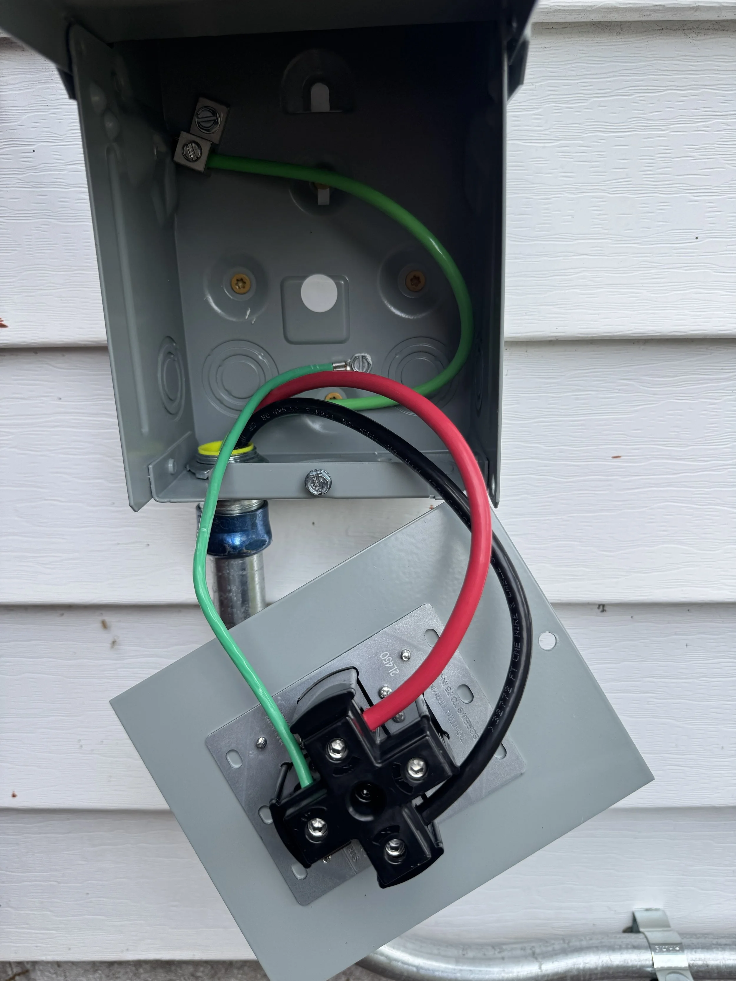 Weatherproof outdoor box wired through the wall of a Suffolk, VA home