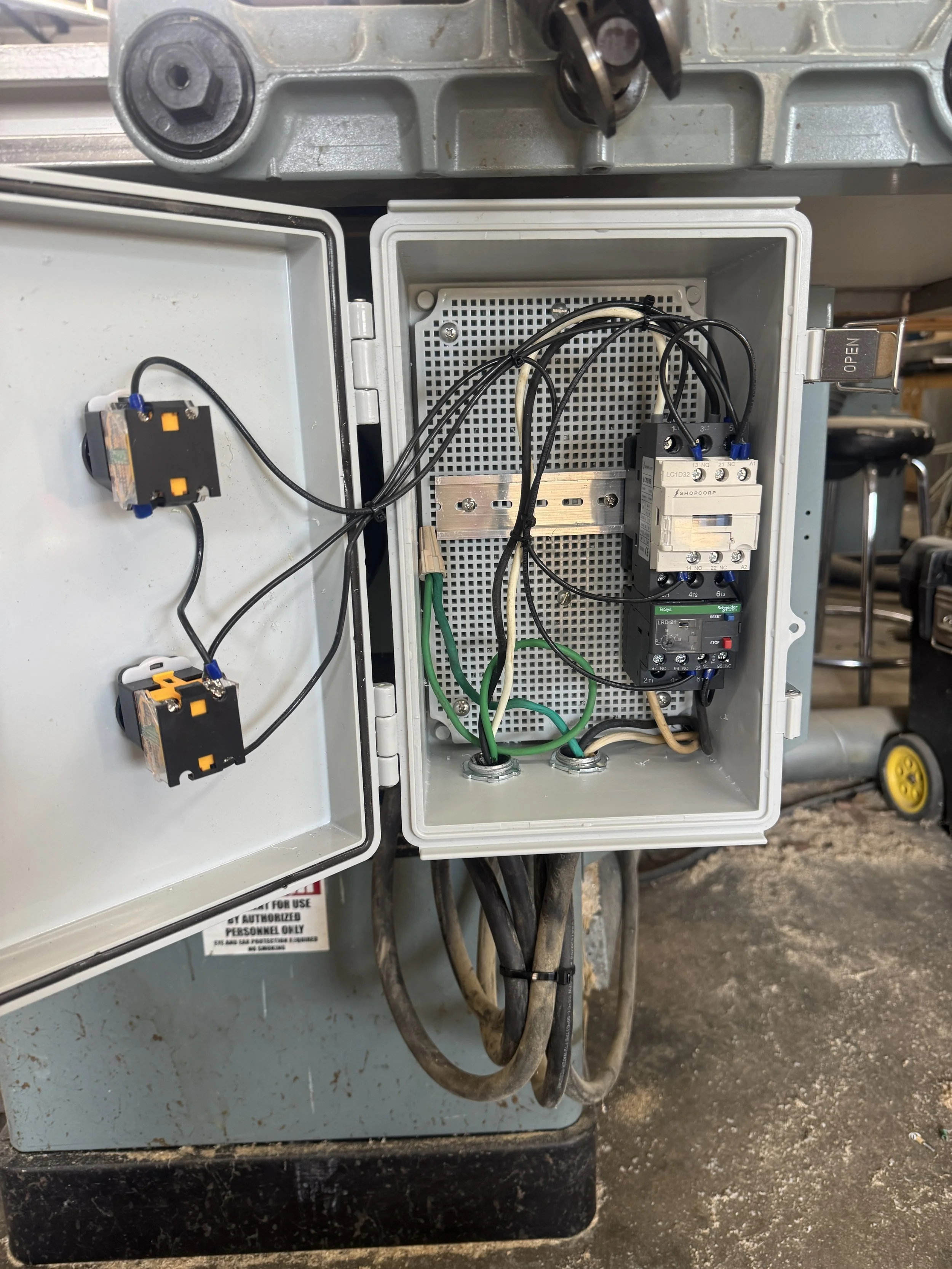 Control enclosure opened up, with contactors and fused disconnects inside