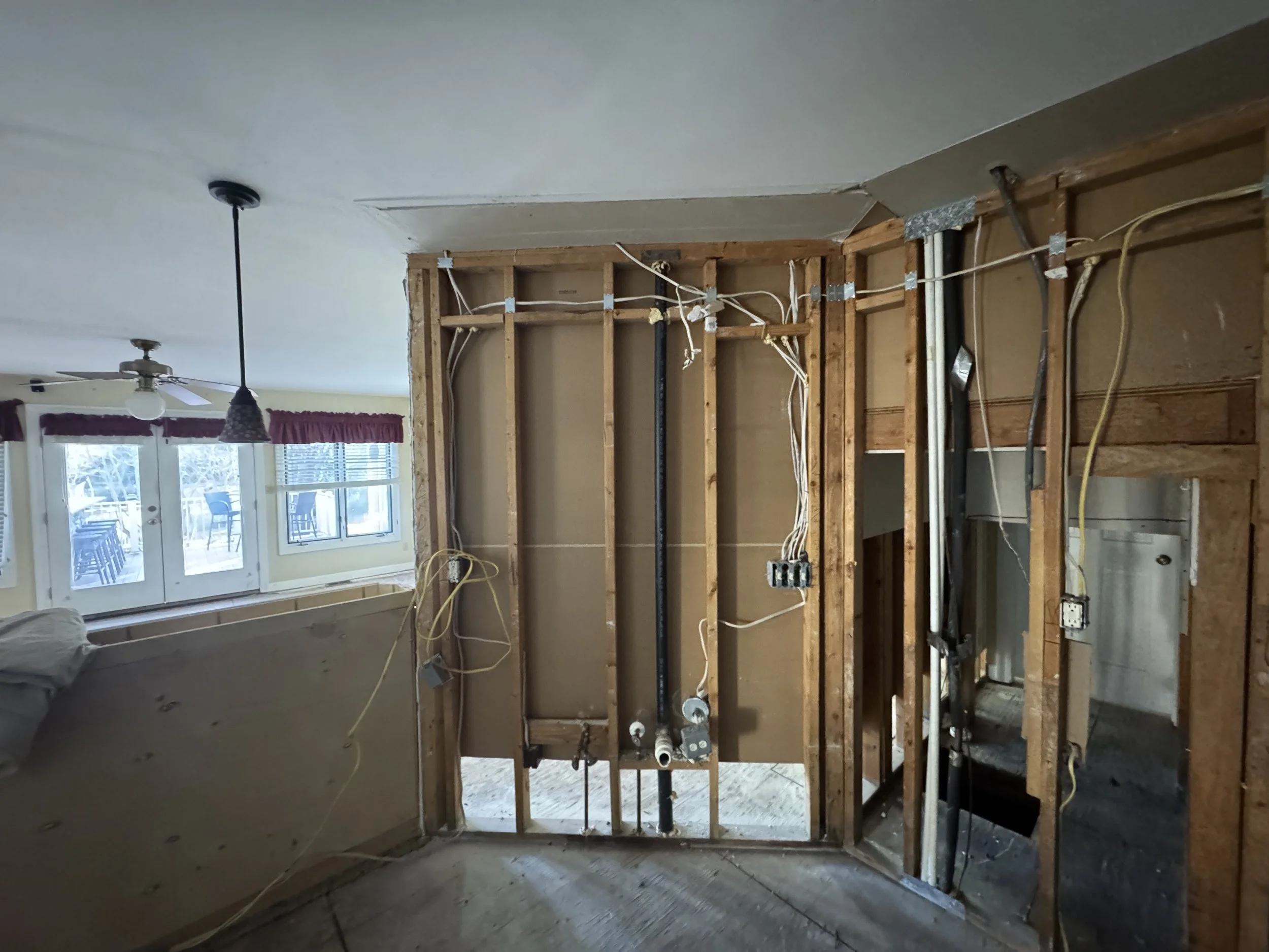 Room in a Chesapeake, VA home with a wall opened back to the framing