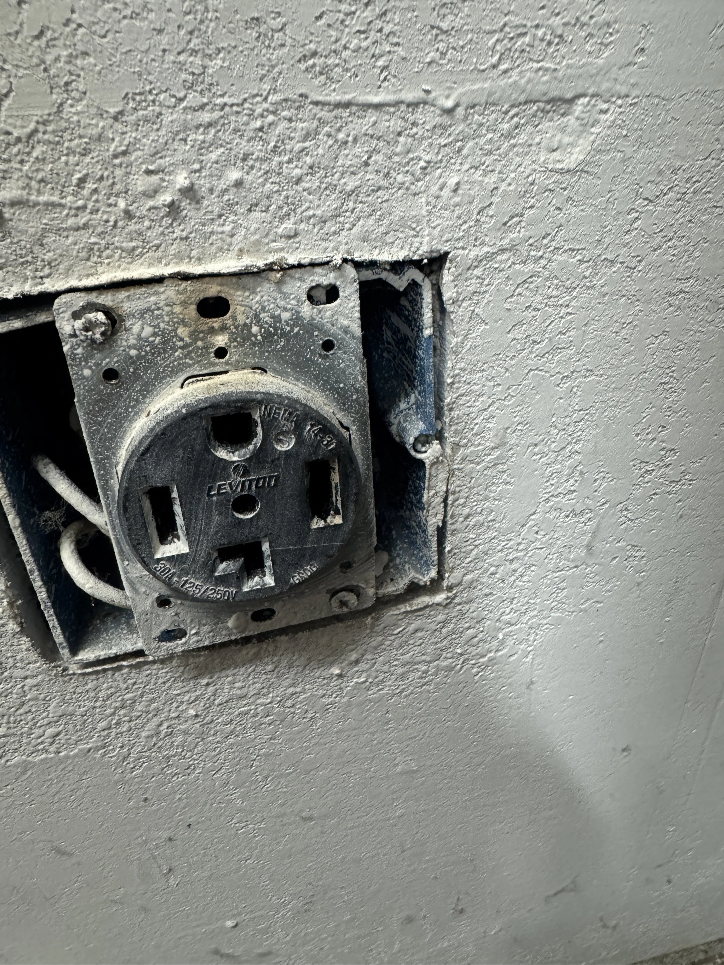 Existing 240-volt appliance receptacle in the wall of a Norfolk, VA home
