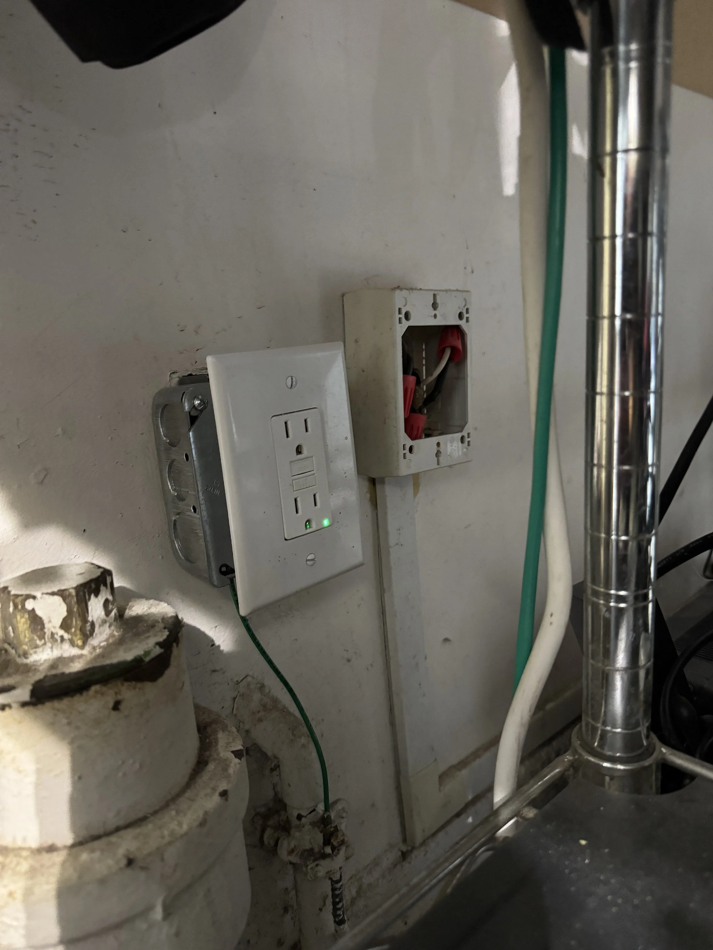 Receptacle added beside the water heater on a Suffolk, VA property