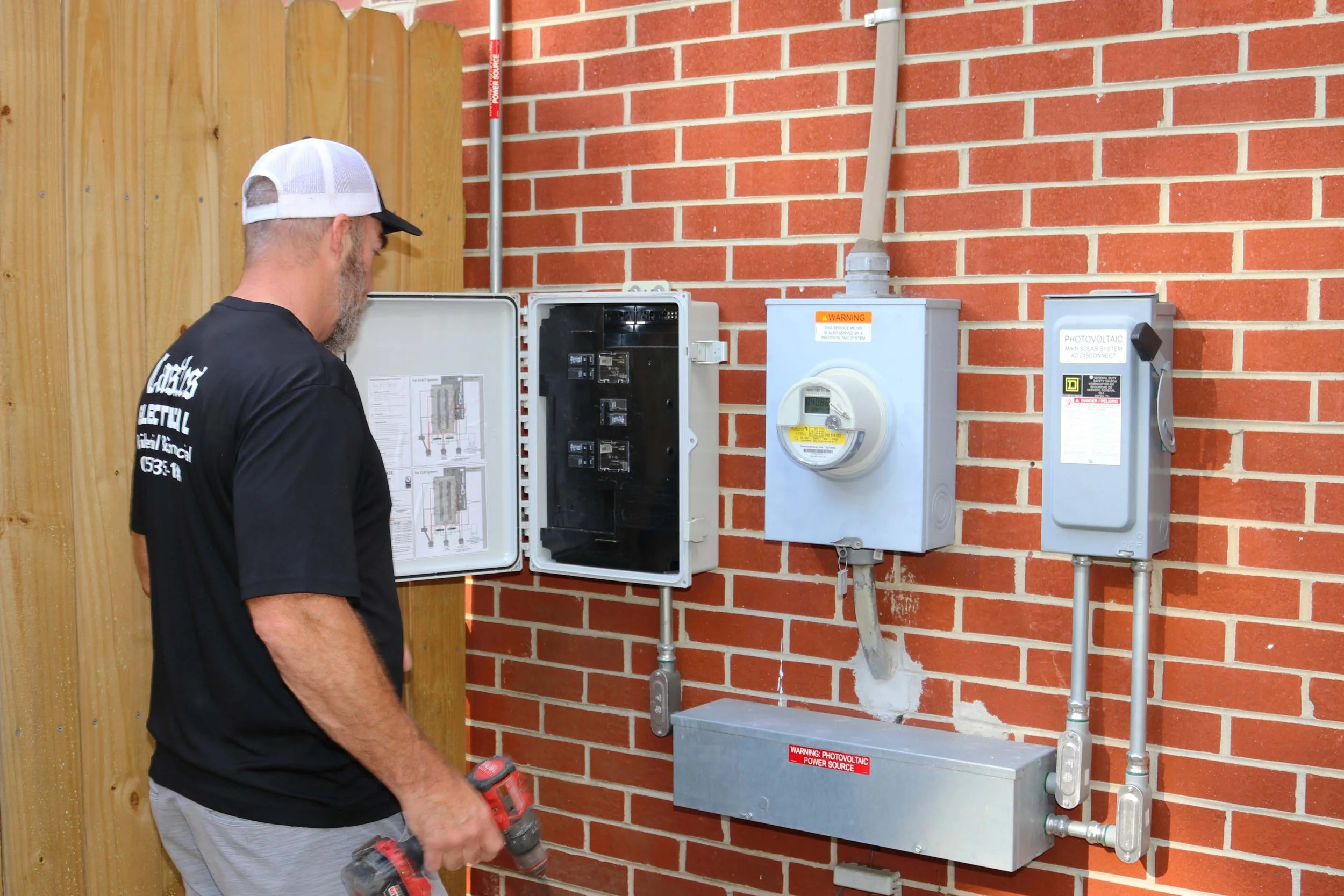 Castles Electrical electrician at the service equipment of a Chesapeake, VA home