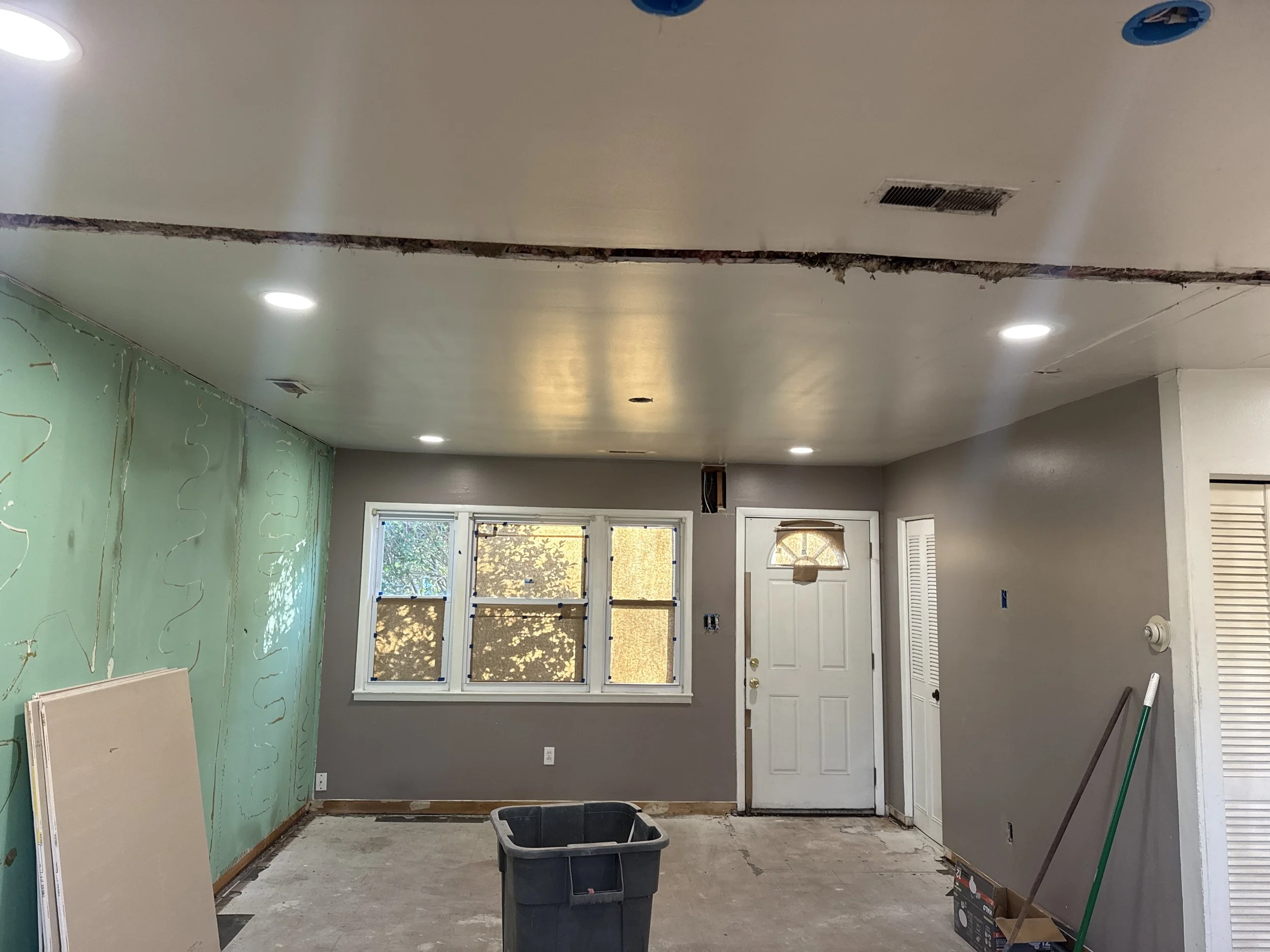 Room in a Suffolk, VA house being rewired, with the new ceiling lights on