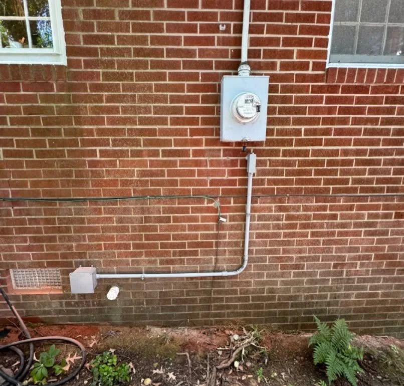 Outdoor circuit run down the wall of a Suffolk, VA home to the spot where it is needed