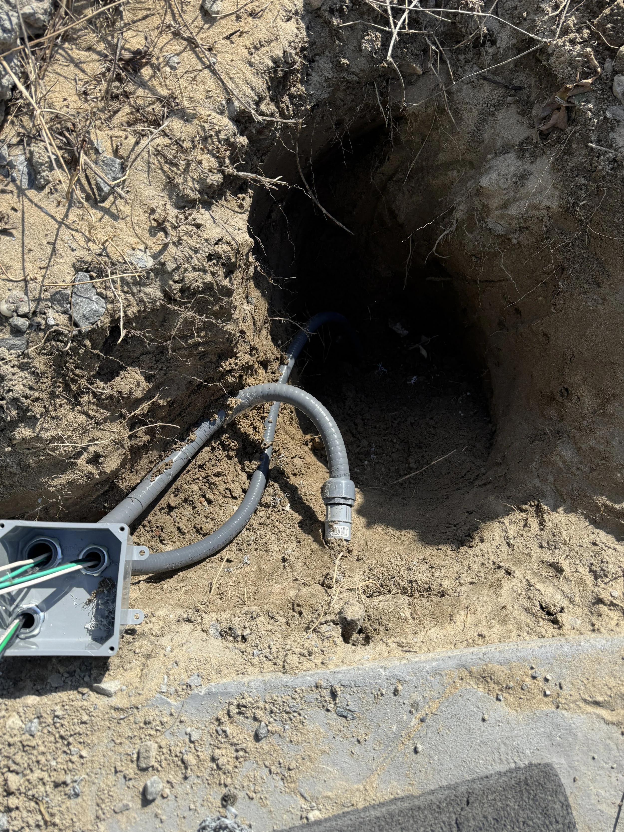 Conduit turned down below a slab edge on a Suffolk, VA property