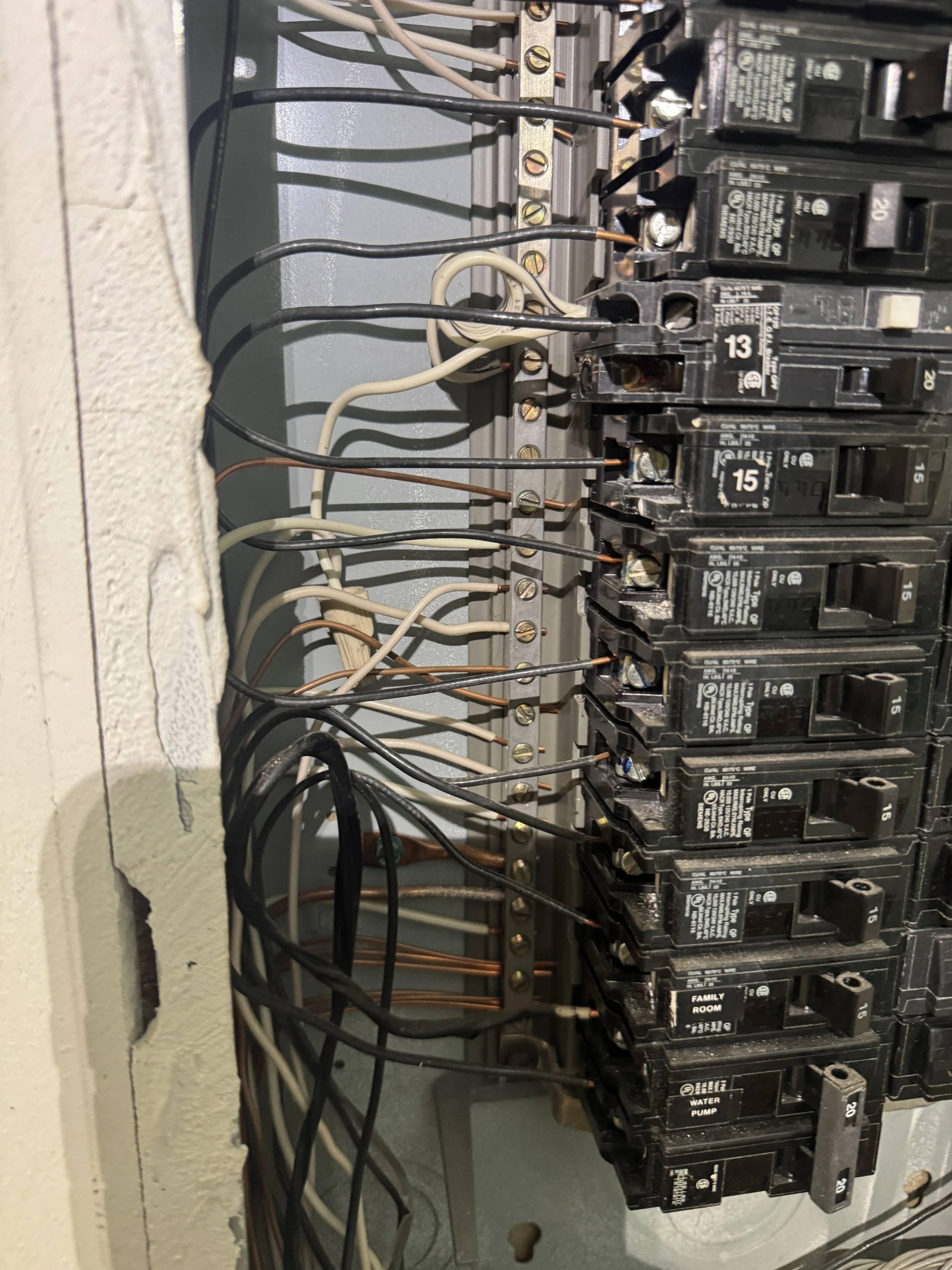 Installed breakers in a Chesapeake, VA panel, their side markings out of sight