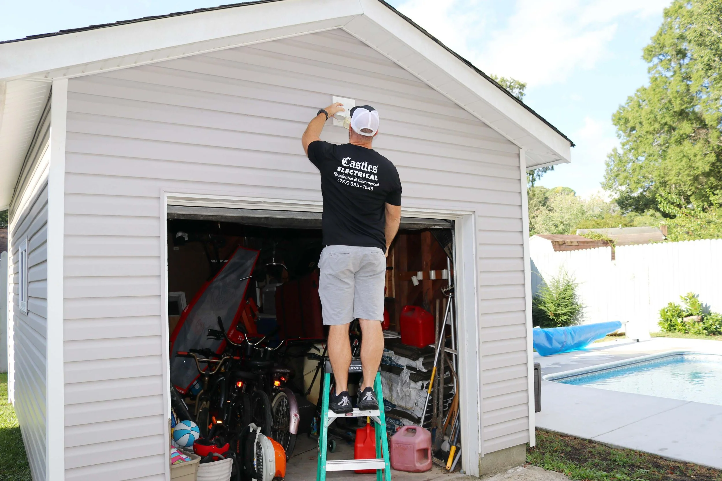 Castles Electrical electrician working at a detached garage in Chesapeake, VA