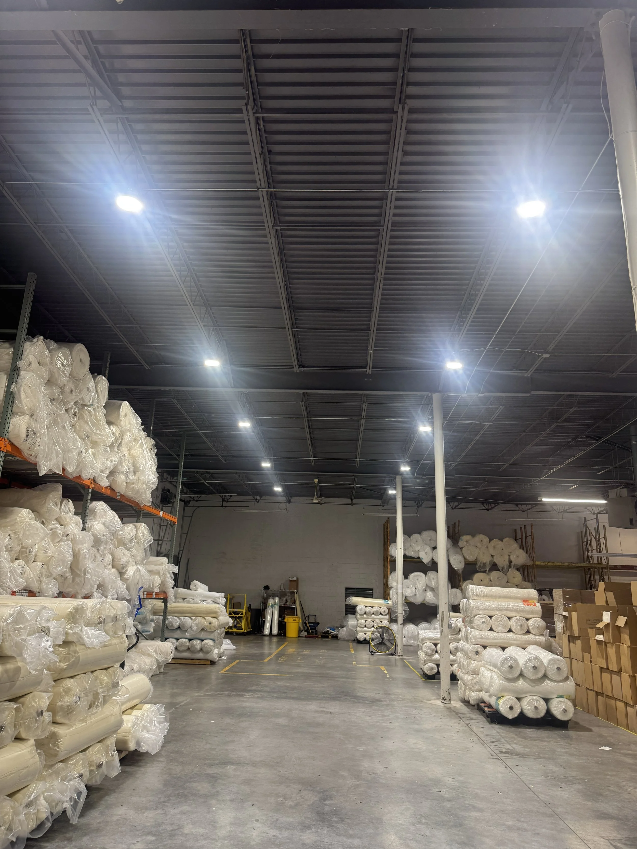 High-bay lighting finished across a commercial floor