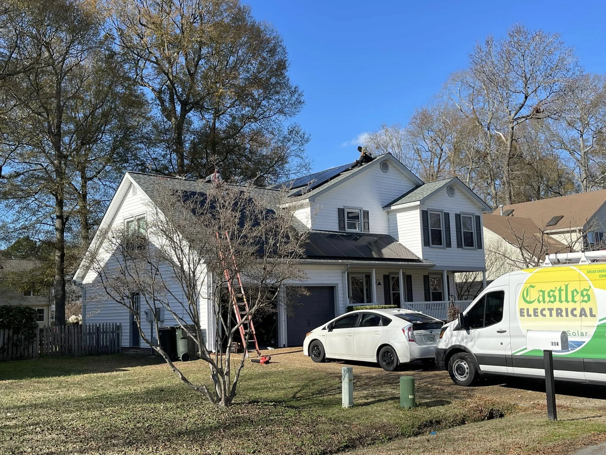 Castles Electrical van at a two-story home in Portsmouth, VA