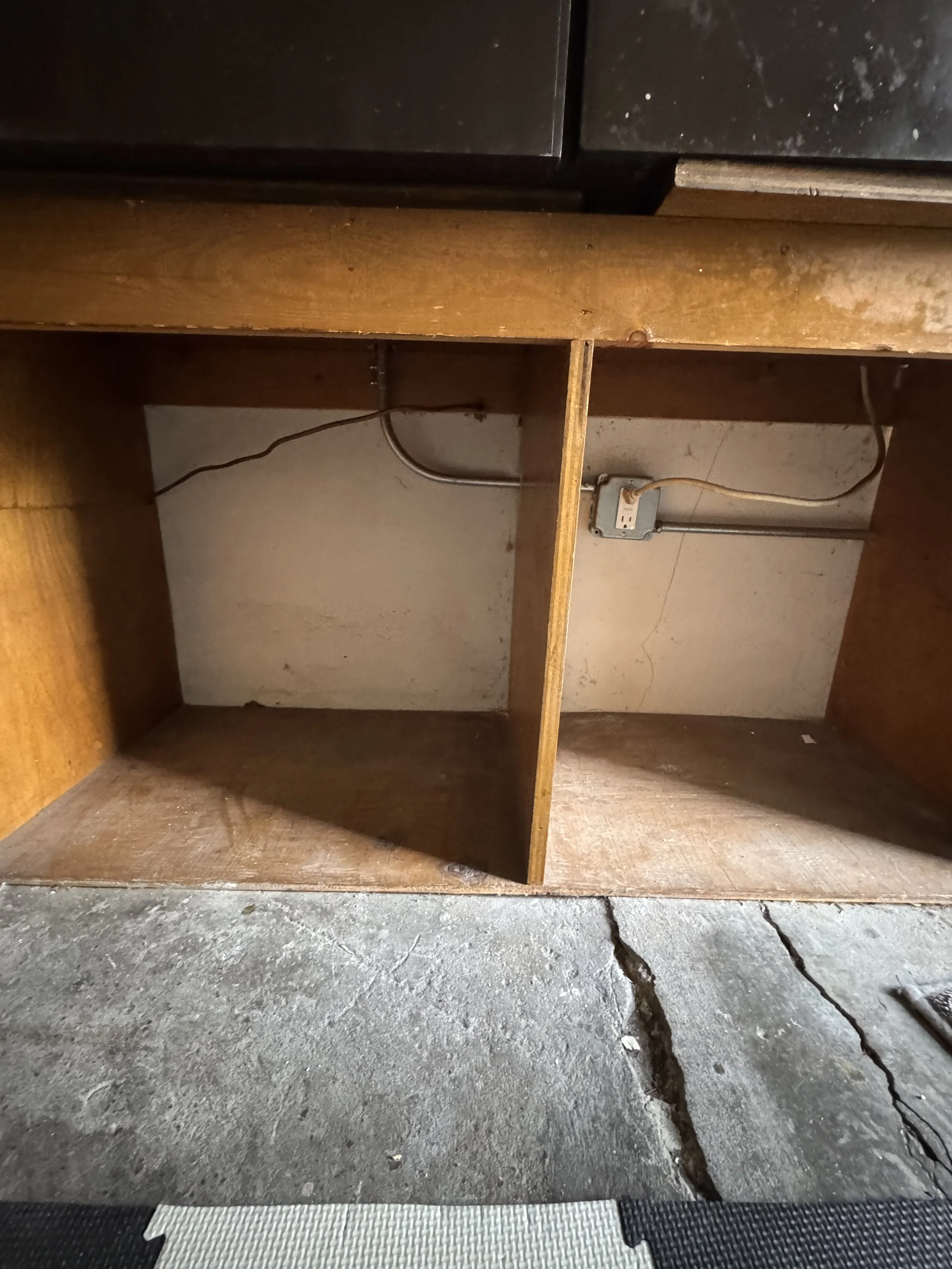 Cable and a receptacle in an unfinished space beneath an older Suffolk, VA house