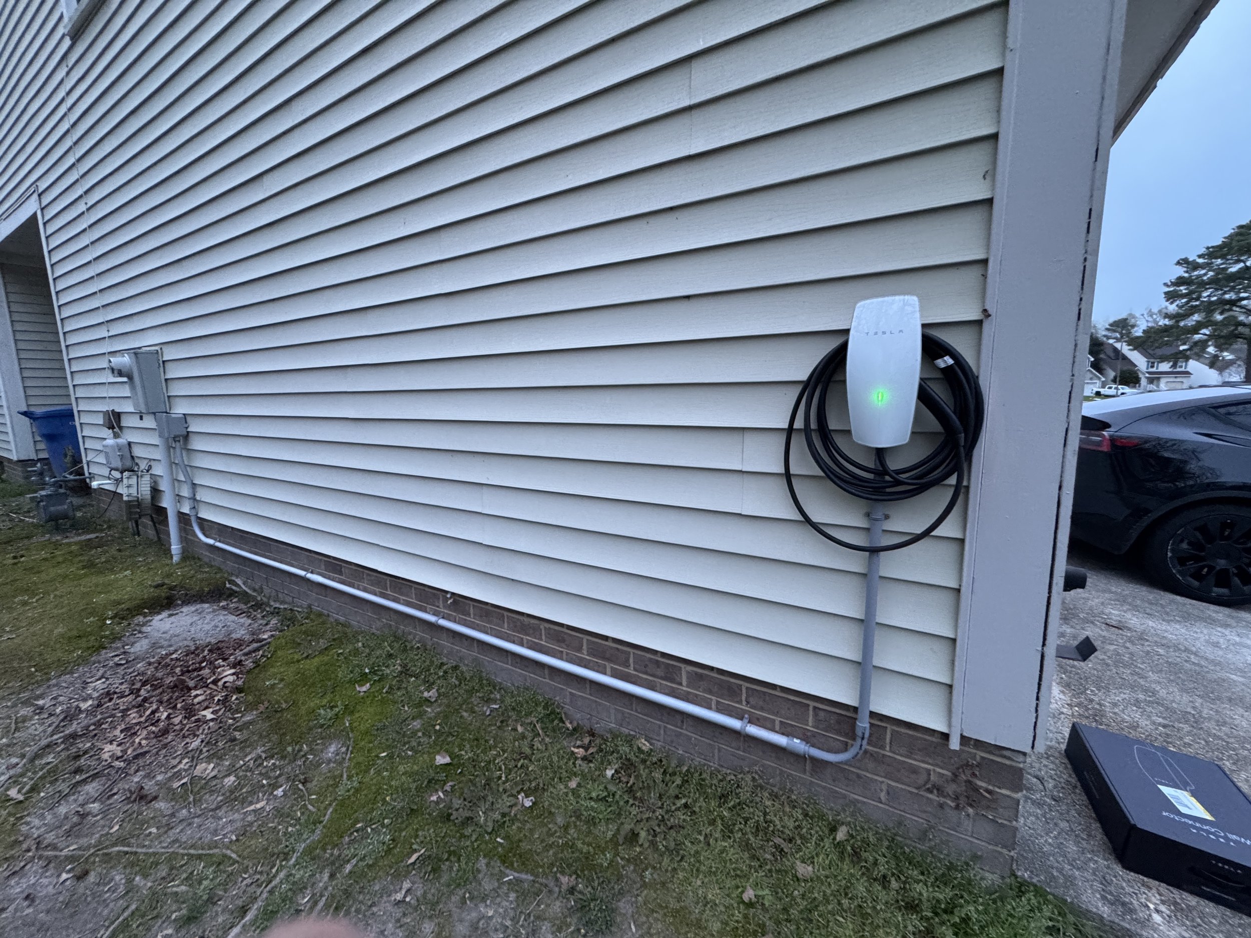 Level 2 charger on the outside wall of a Suffolk, VA home