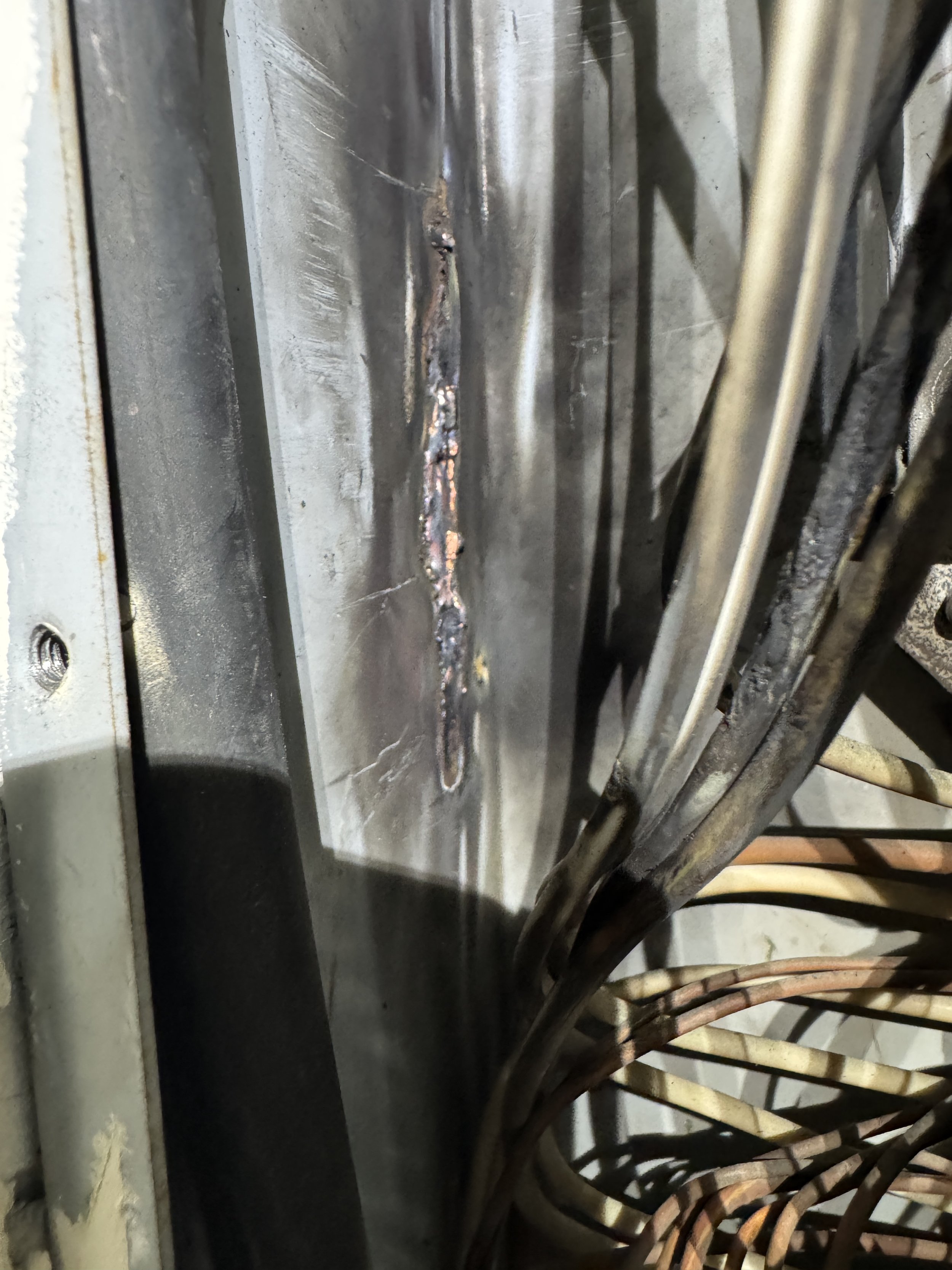 Scorch marks inside a Suffolk, VA panel enclosure checked after a storm