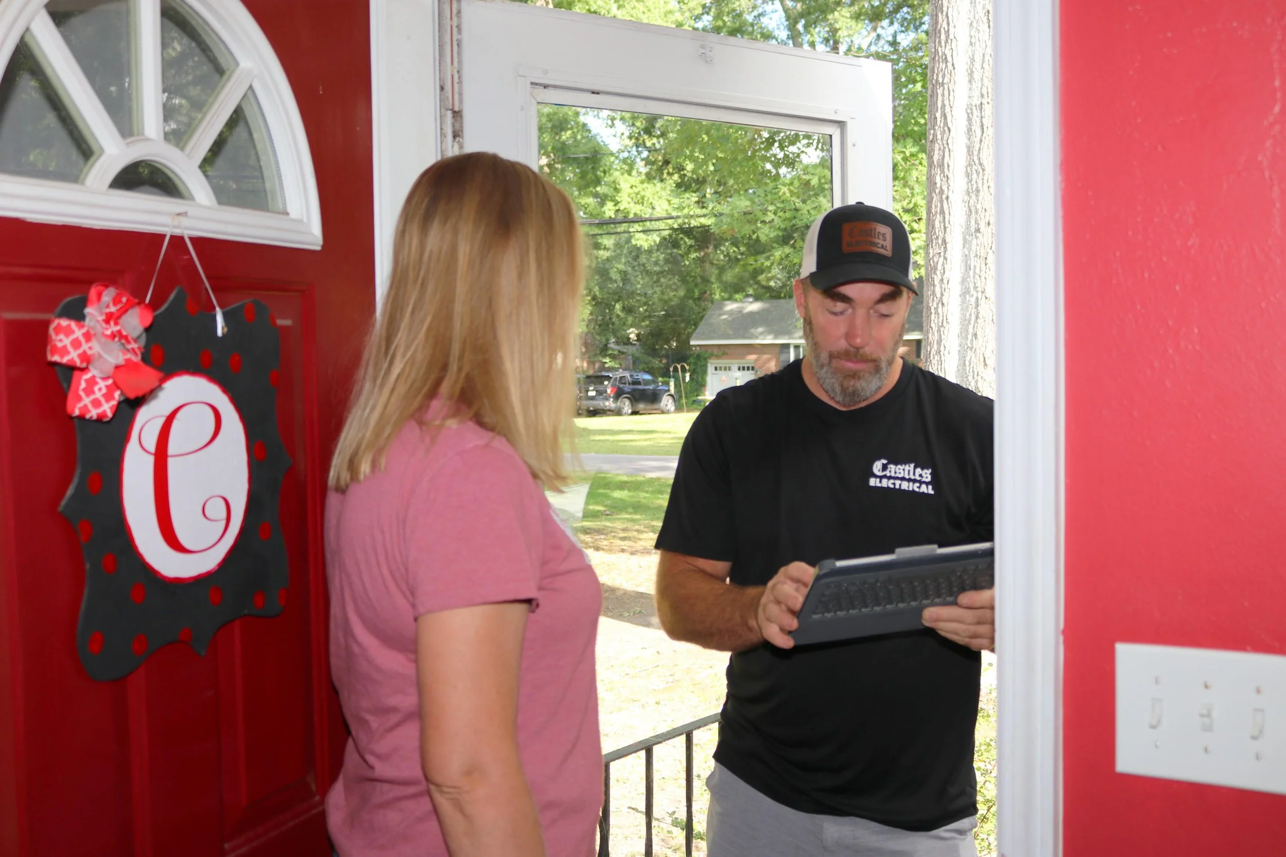 Castles Electrical electrician going over the job with a Portsmouth homeowner