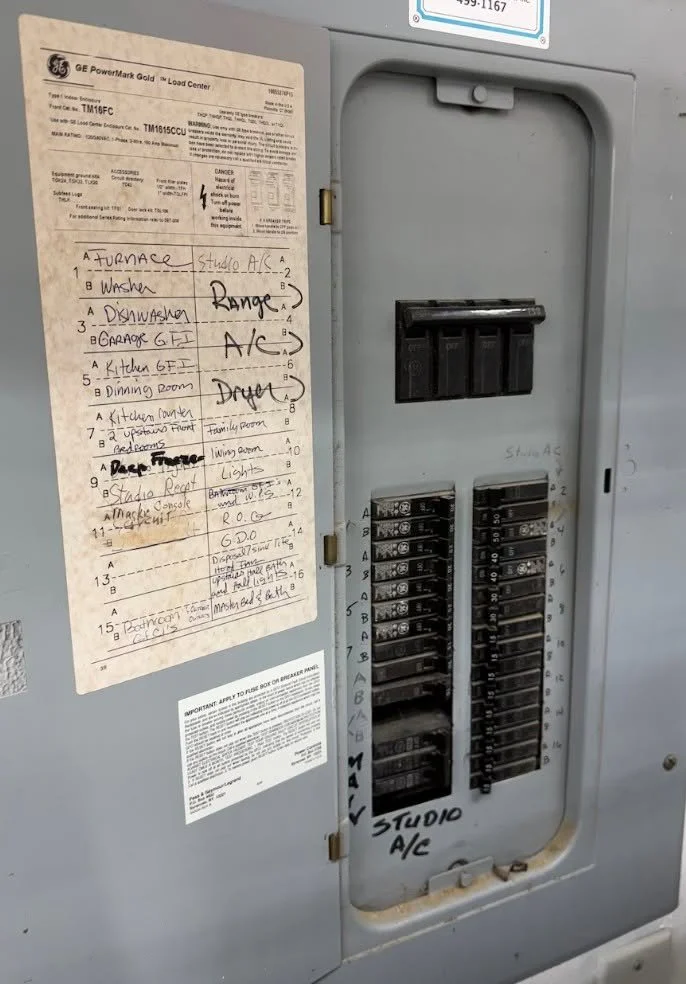 Panel directory naming the range and dryer circuits in a Norfolk, VA home