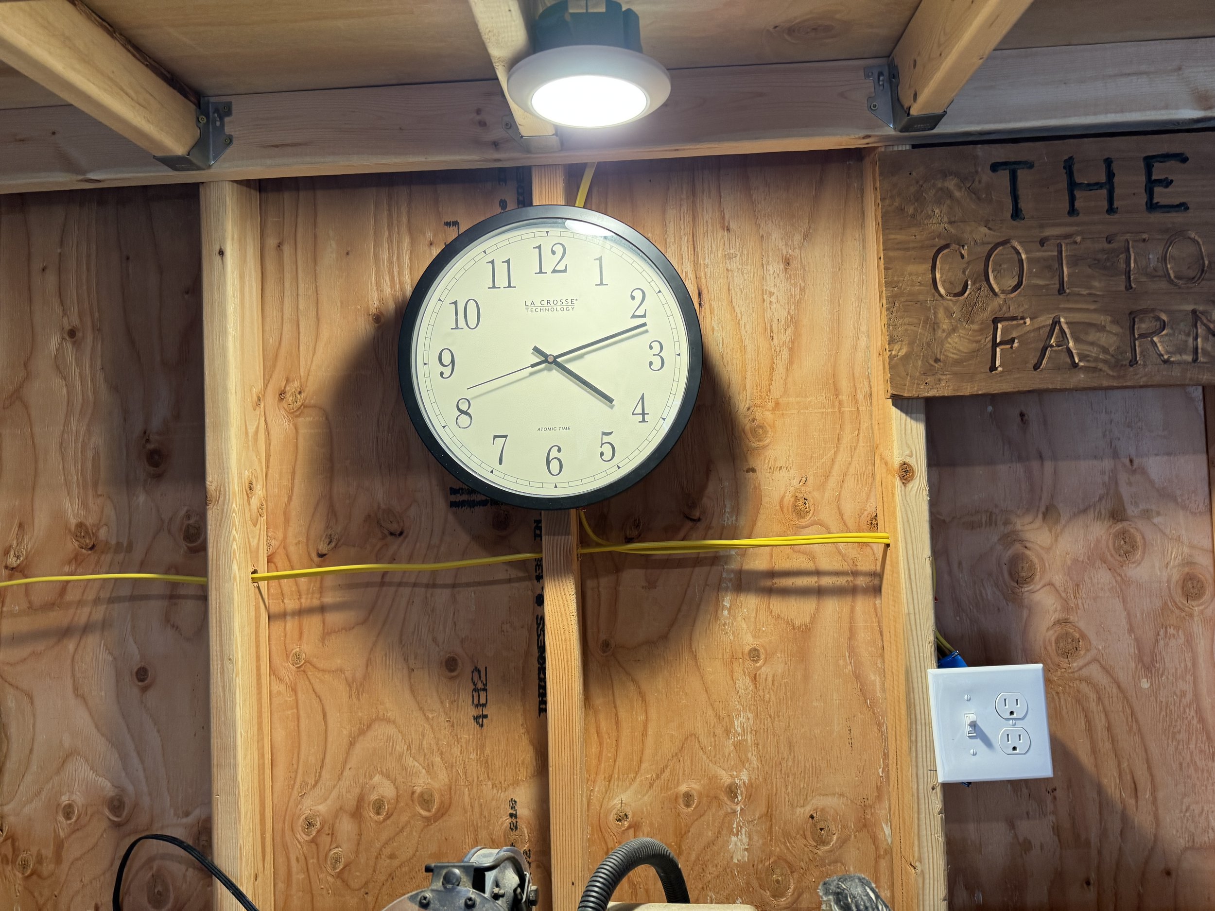 New light and wall switch over a workbench in a shop building