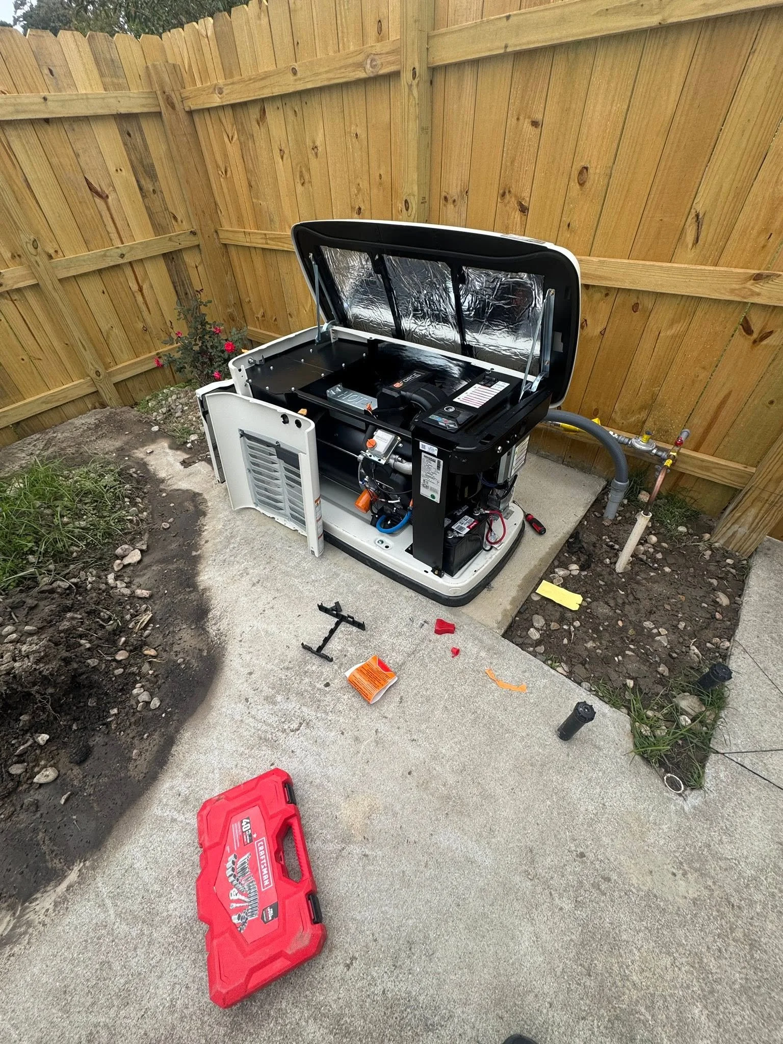 Standby generator open on its pad during a Norfolk, VA installation