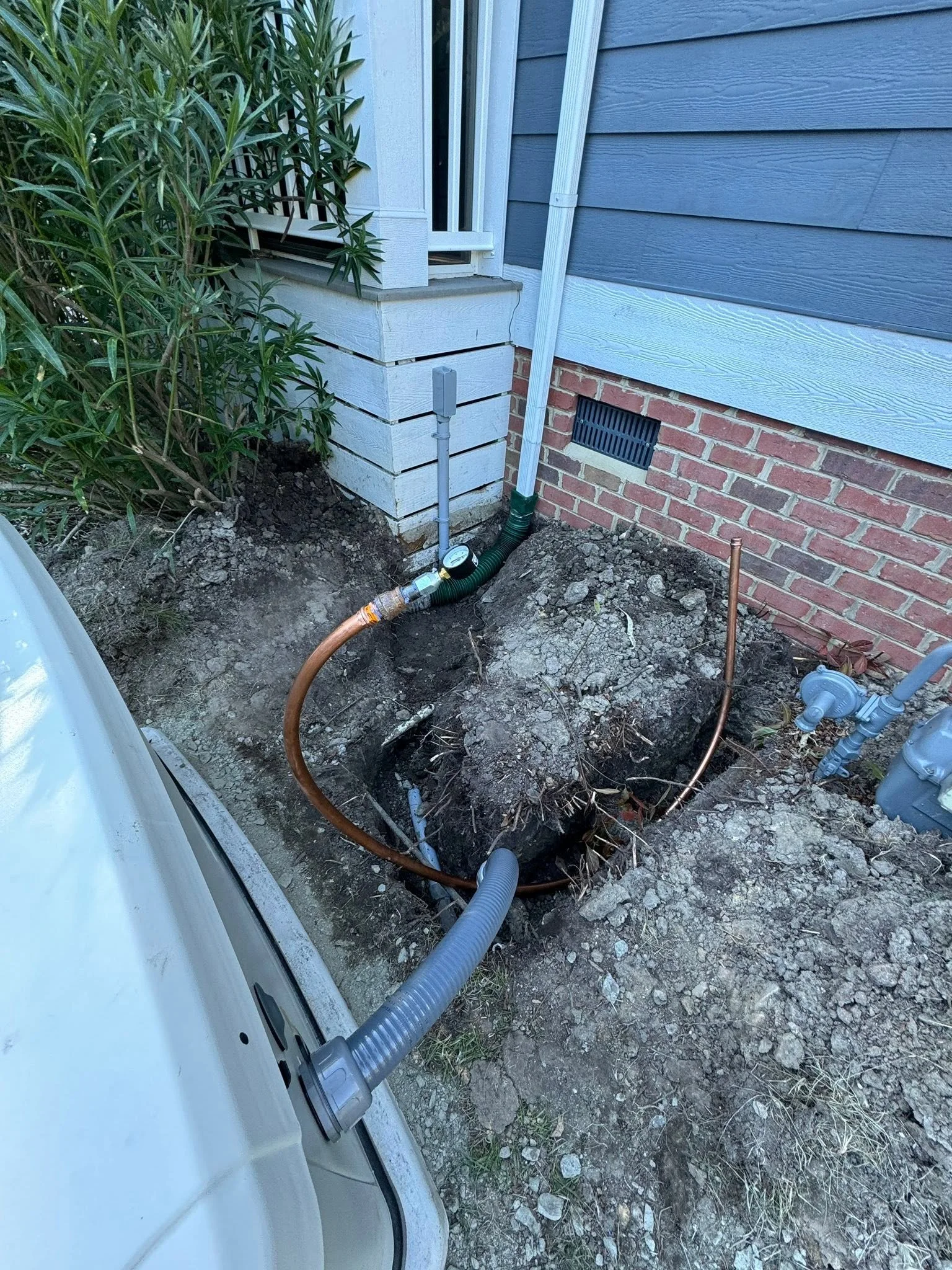 Underground run brought in through the narrow side yard of a Portsmouth, VA home