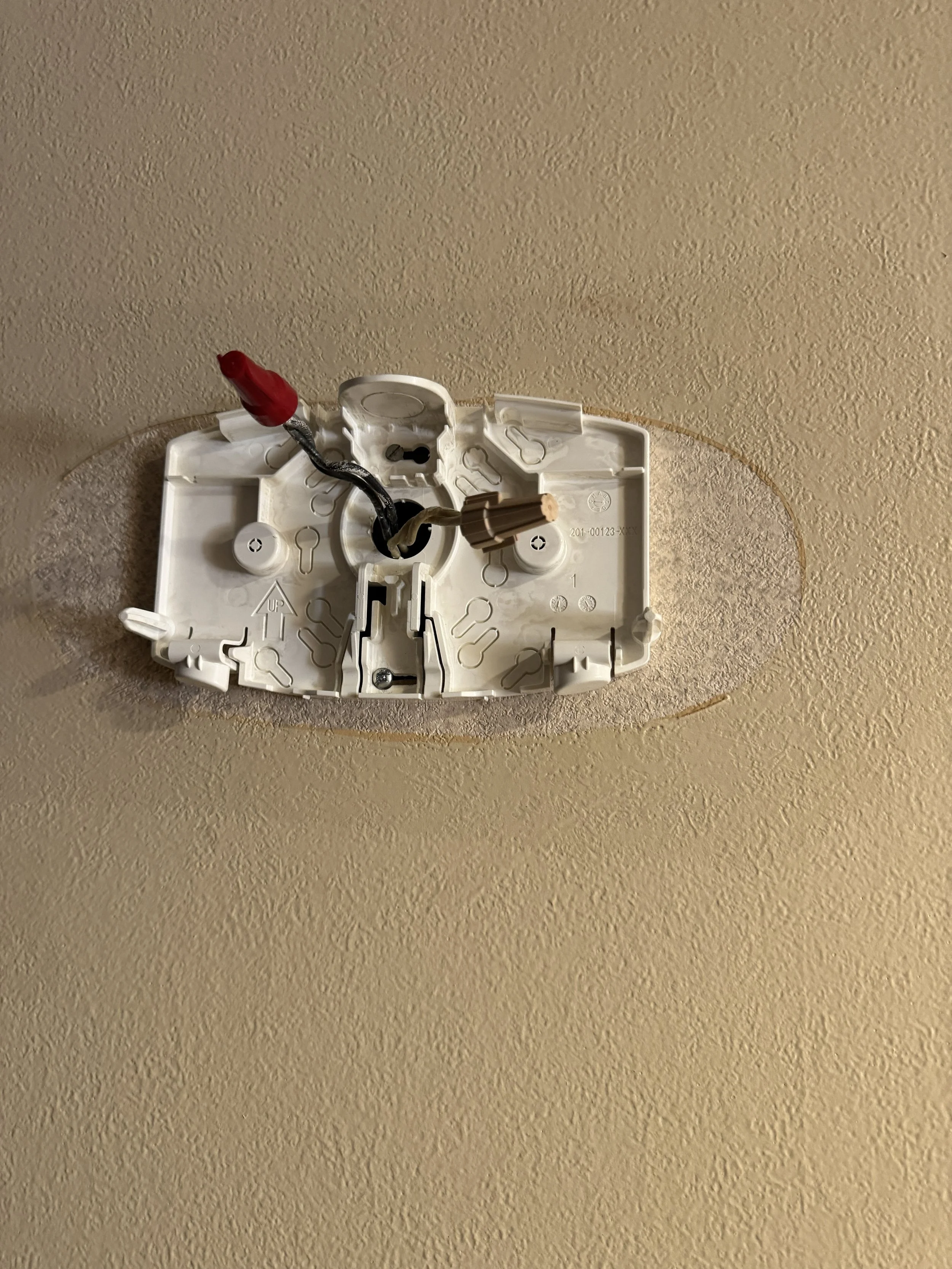 Emergency light unit removed so its box and supply circuit can be checked