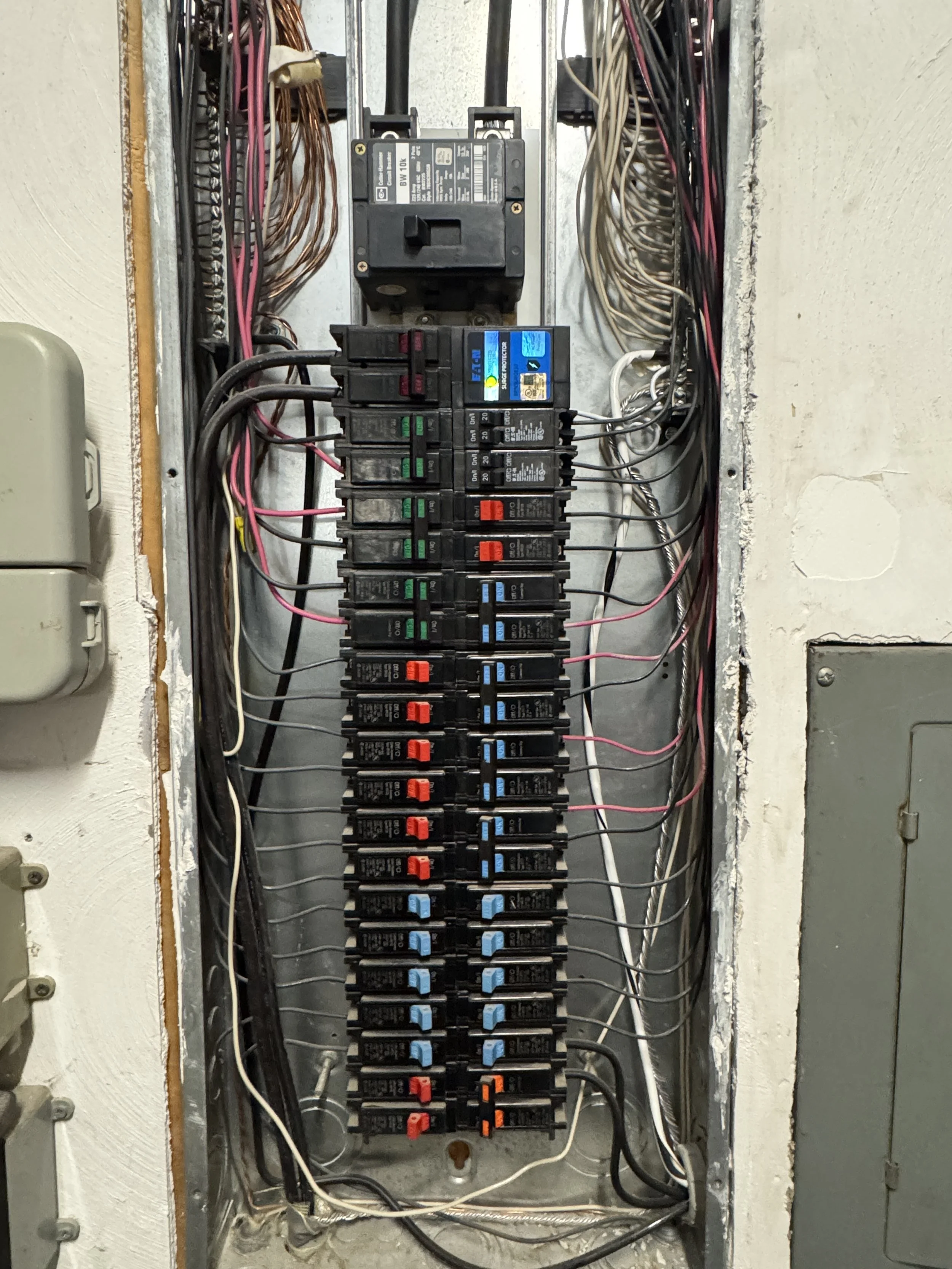 Crowded older Norfolk, VA panel with circuits from several decades