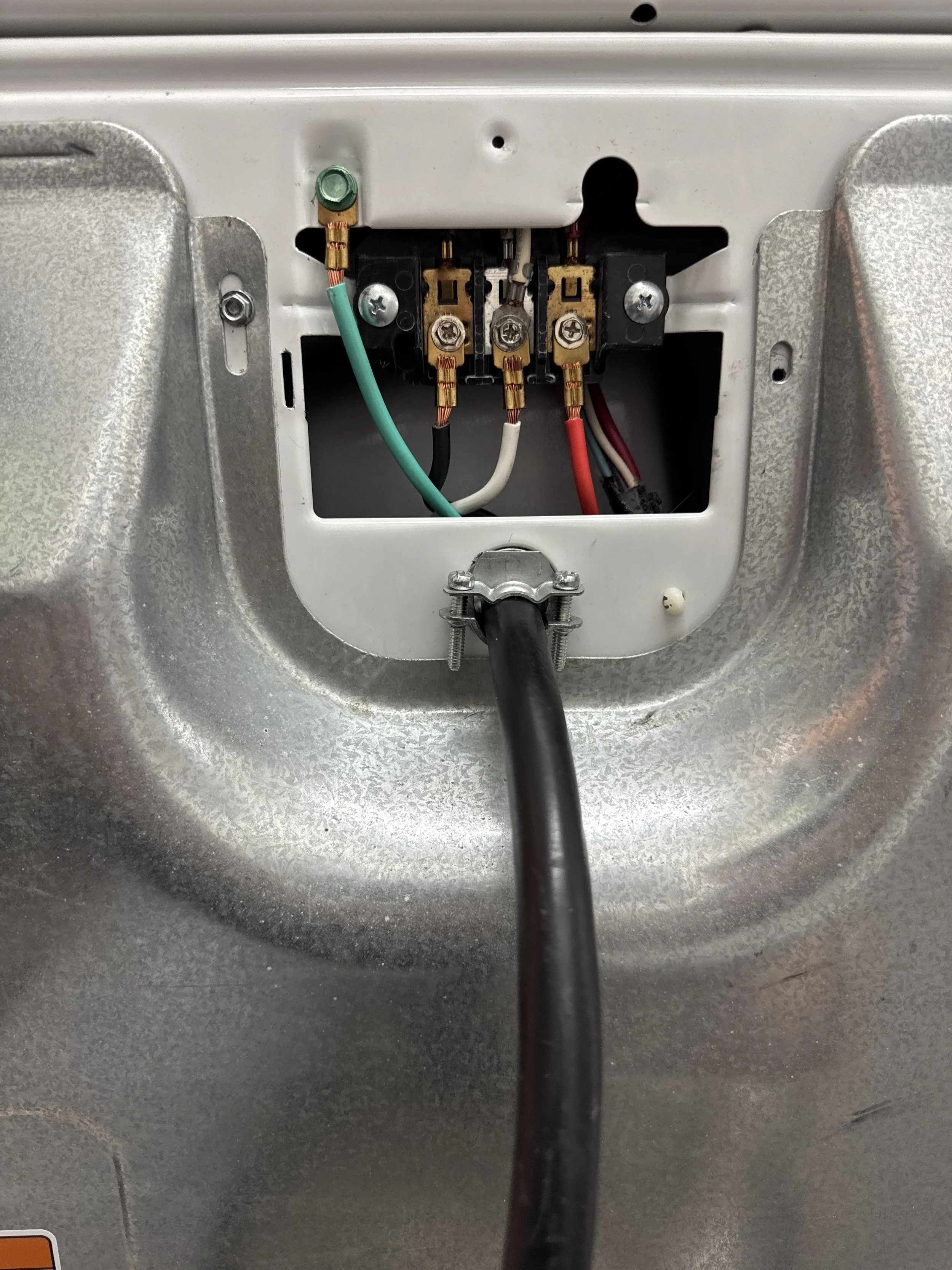 Terminal block inside an appliance where its circuit conductors land