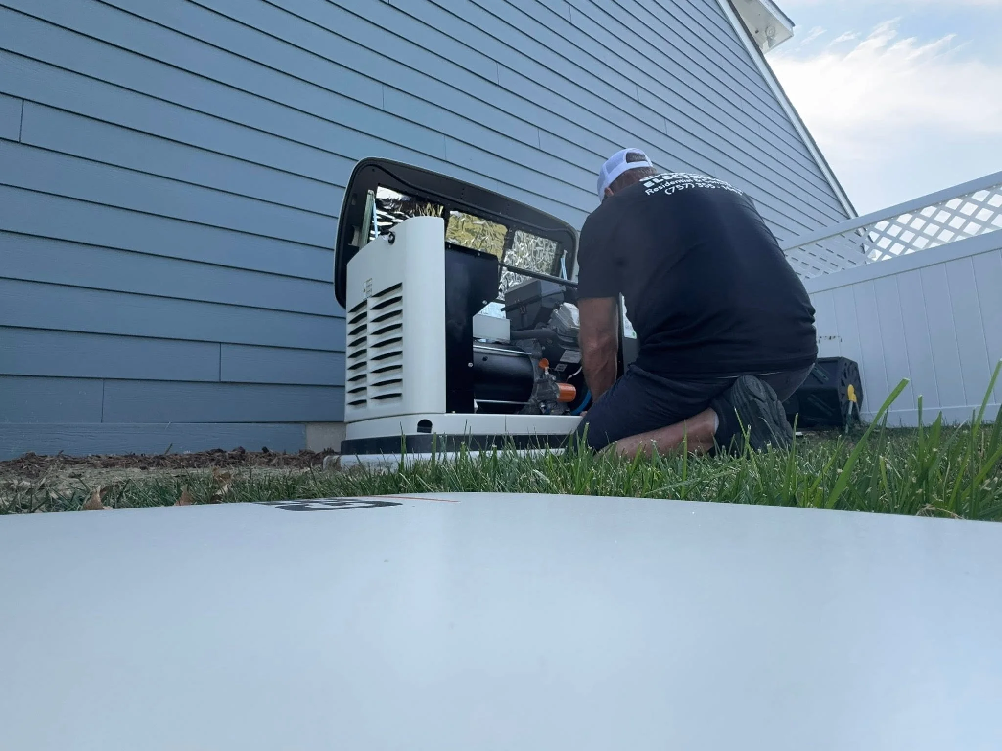 Castles Electrical technician installing a standby generator in Suffolk, VA