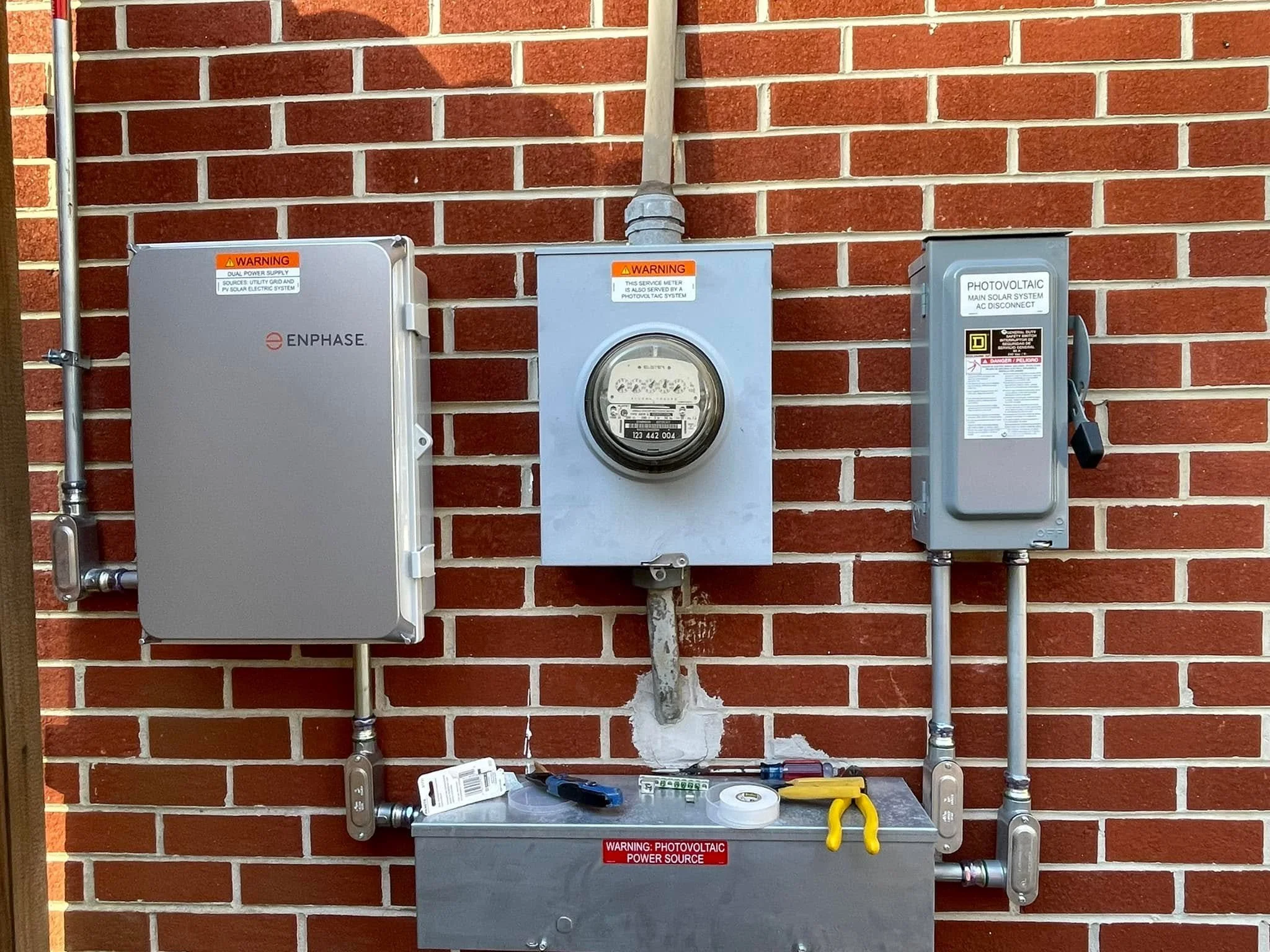 Outdoor disconnect beside the meter on the exterior wall of a Chesapeake, VA home