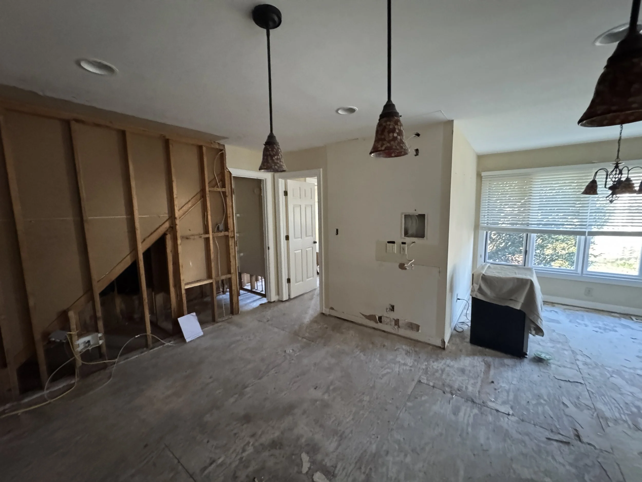 Emptied unit with a wall opened to the framing in a Norfolk, VA building