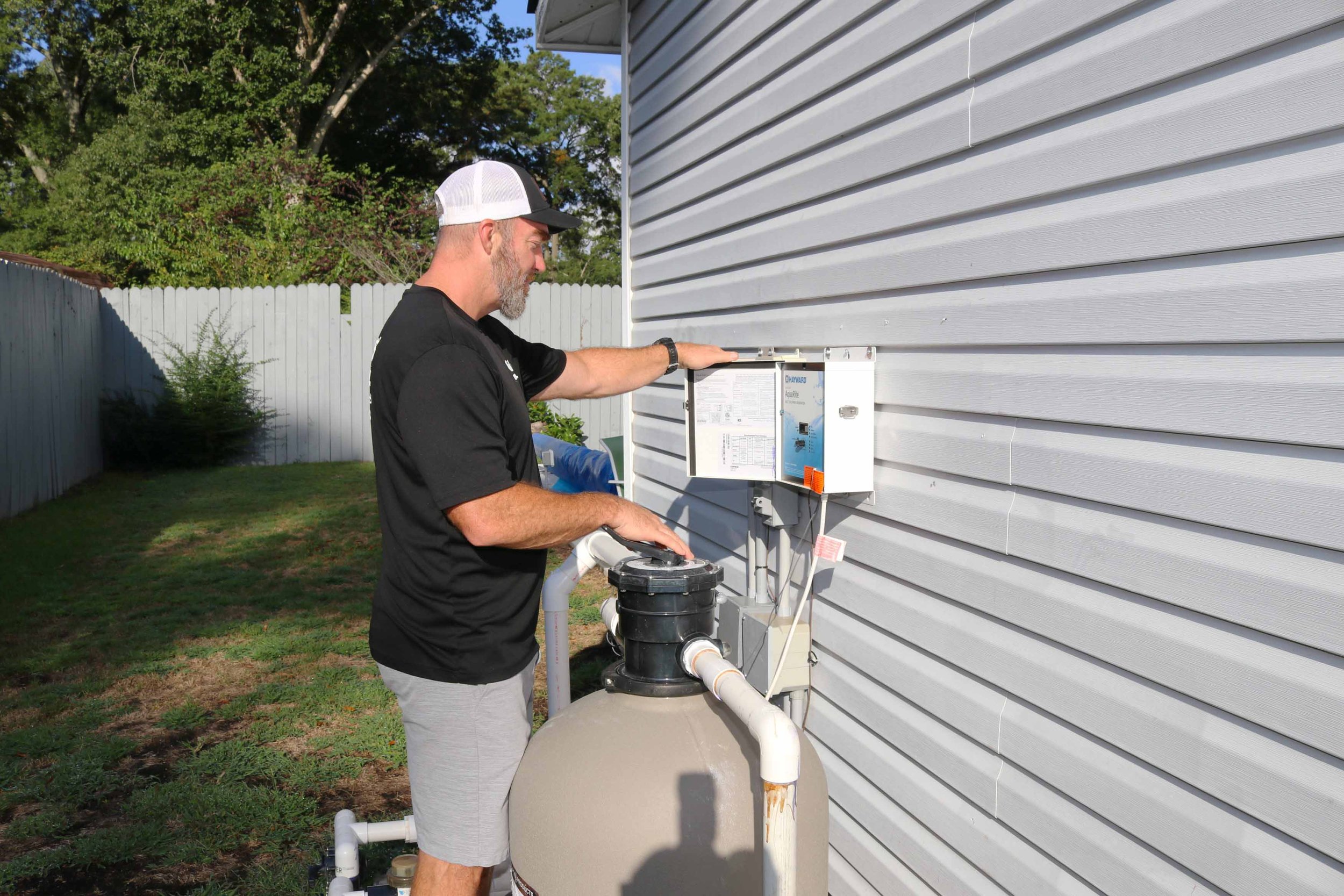 Castles Electrical electrician at the pool equipment controls of a Suffolk, VA home