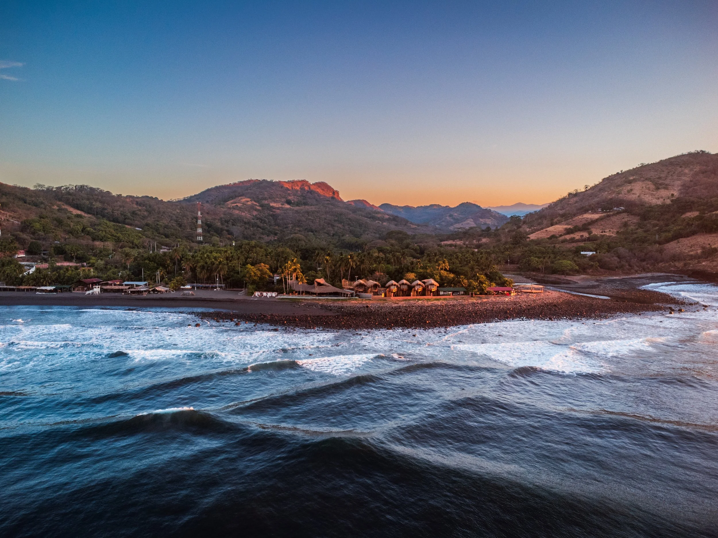 Black volcanic sand beach in Playa Mizata, El Salvador