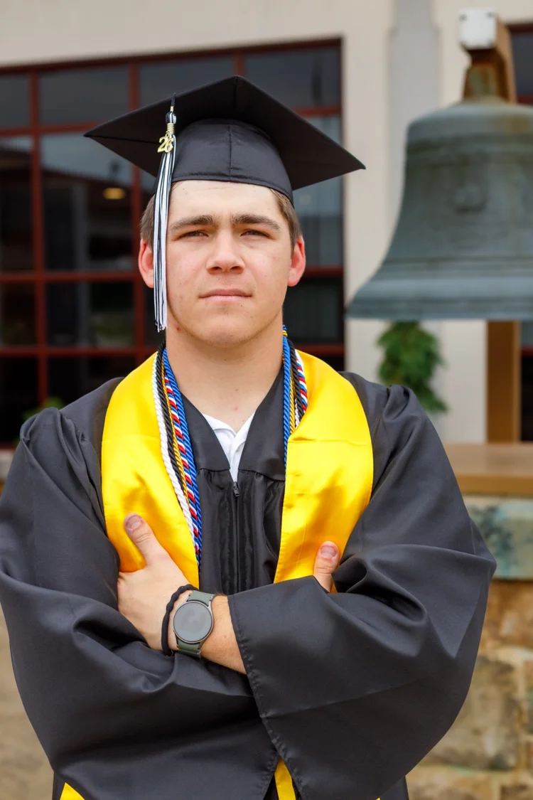 High school senior portrait in cap and gown