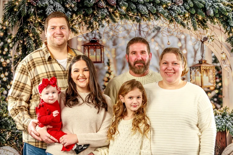 Extended family Christmas portrait in a winter studio set