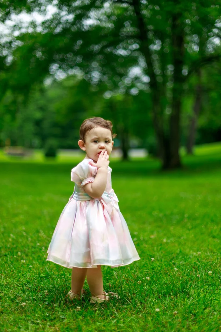Toddler portrait in a green park