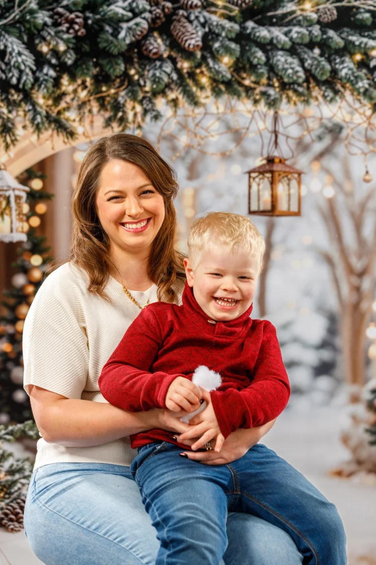 Mother and child smiling during a Christmas portrait session