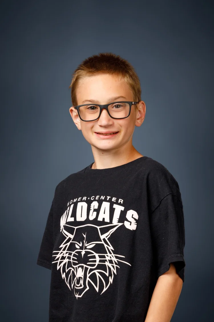 Elementary school portrait on a classic blue background