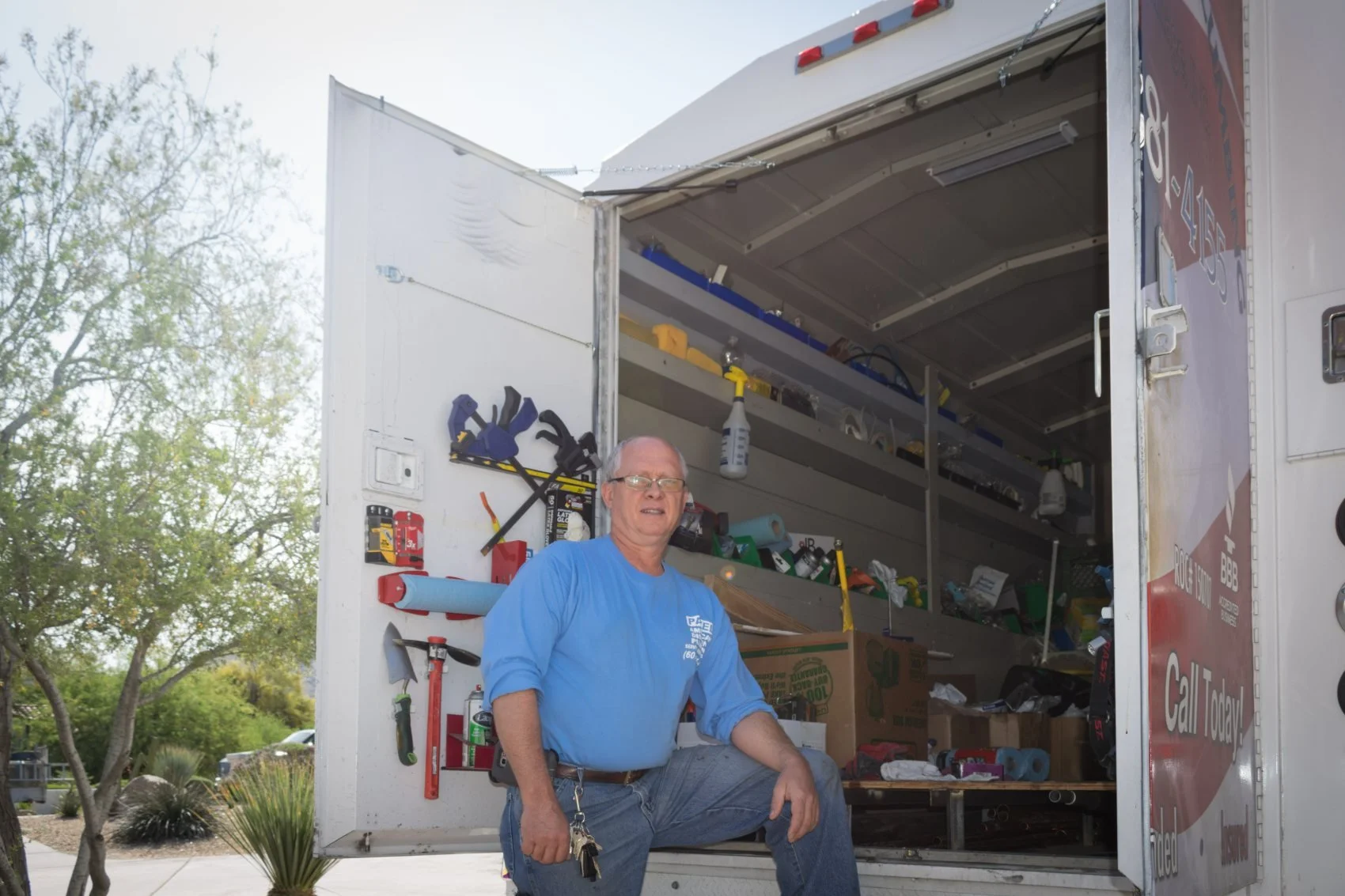 Pavel Farcas at the American Discount Plumbing service truck in Phoenix.