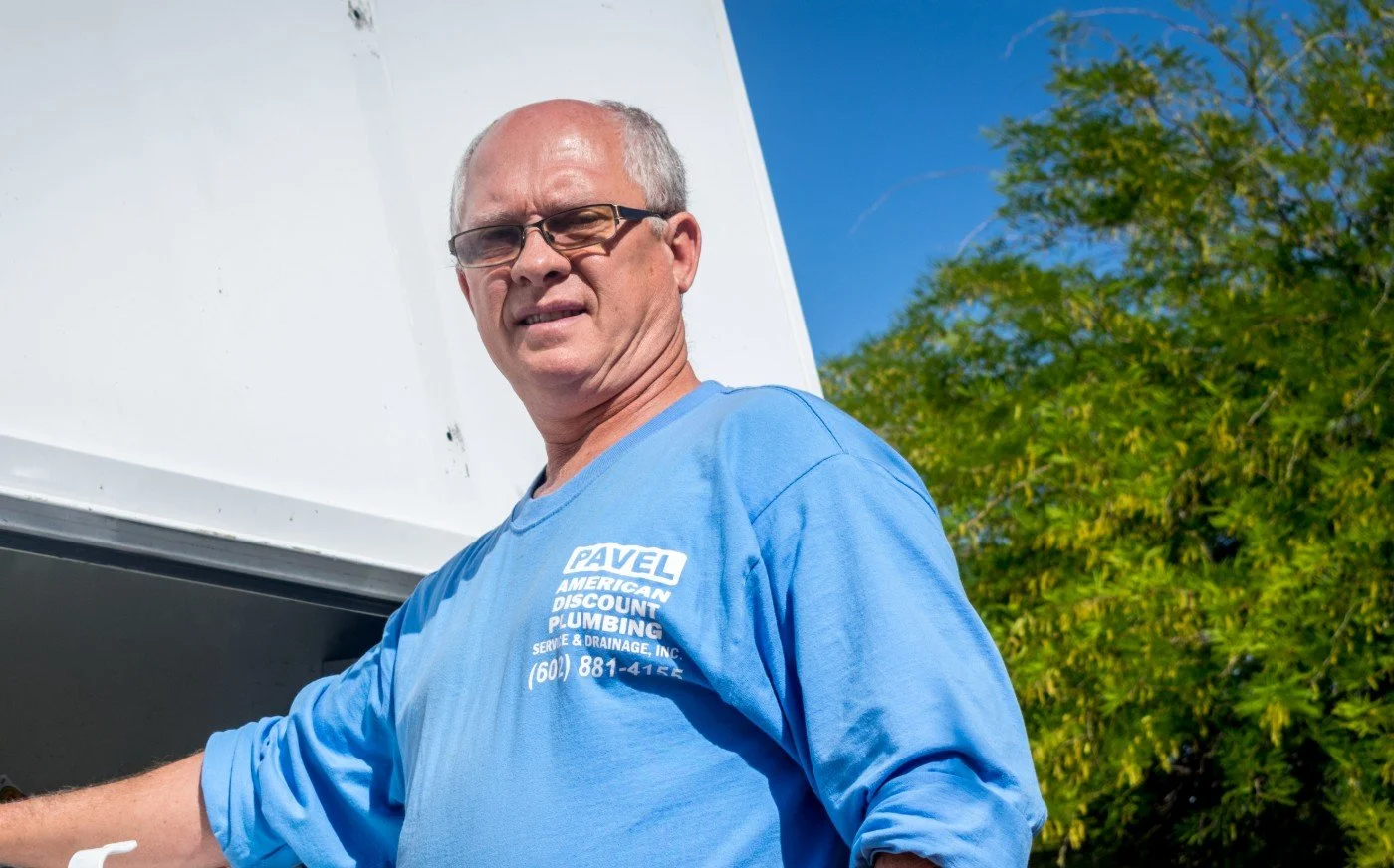American Discount Plumbing installing a whole-home water treatment system in Phoenix.