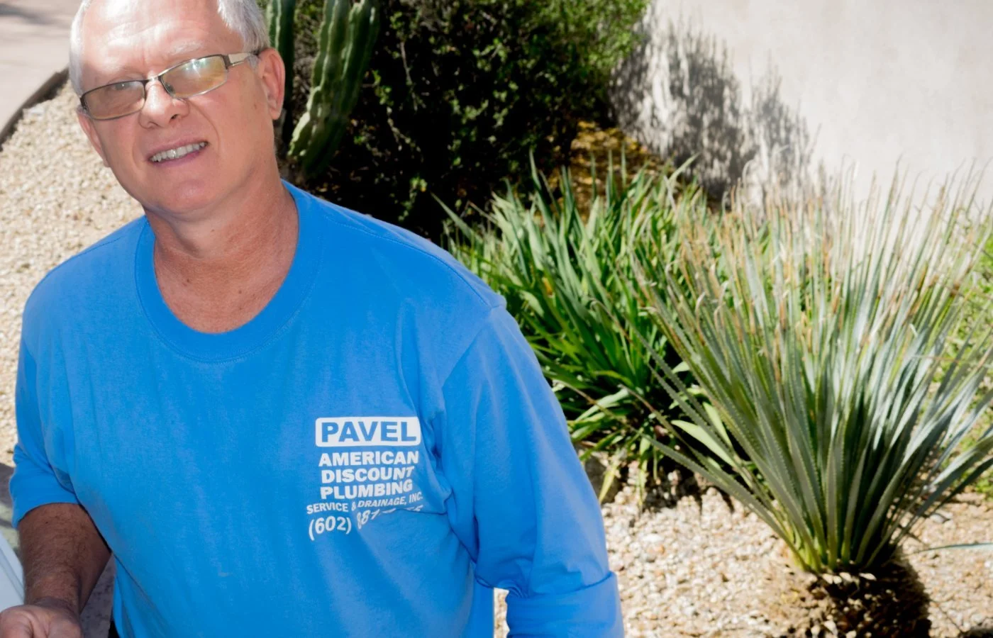 Pavel Farcas replacing a bathroom vanity fixture in a Deer Valley home.
