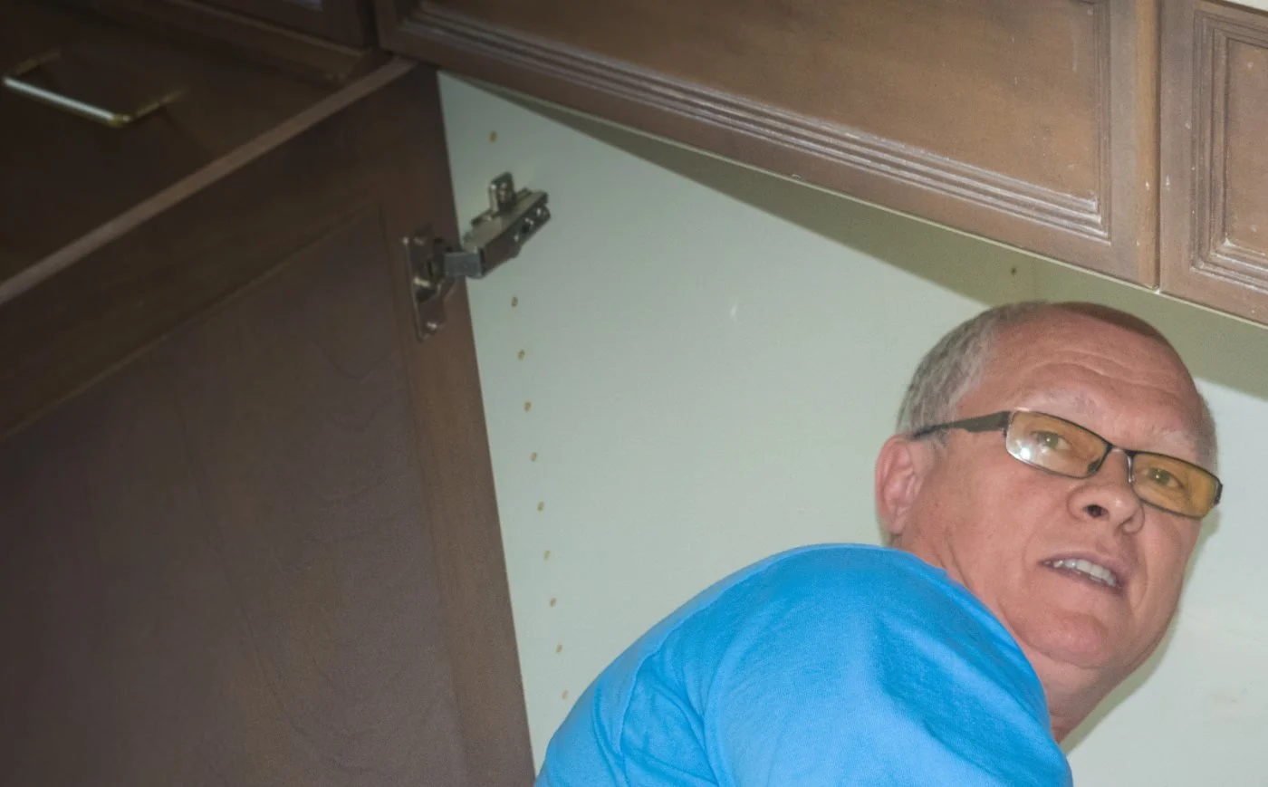 American Discount Plumbing installing an under-sink reverse osmosis system in Phoenix.