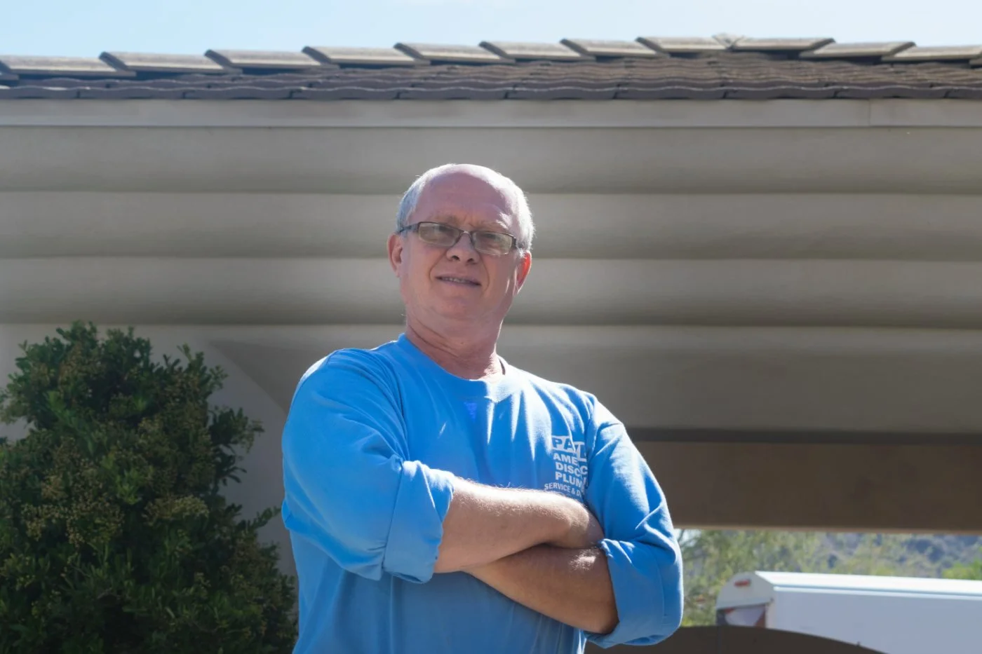American Discount Plumbing servicing a tankless water heater in Phoenix.