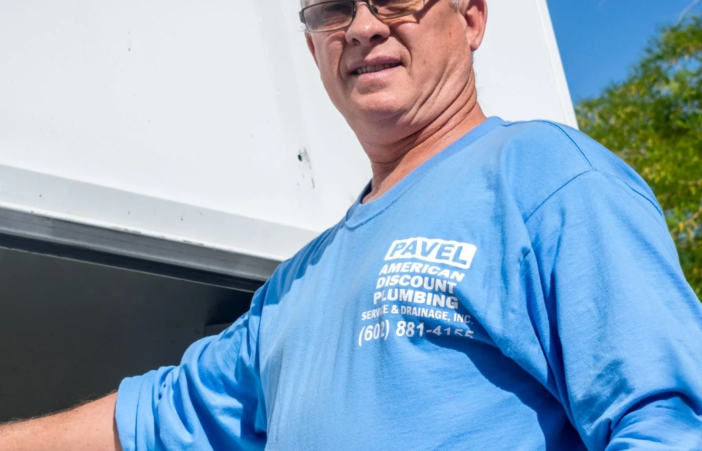 Pavel Farcas replacing a bathroom vanity fixture in a Sun City home.